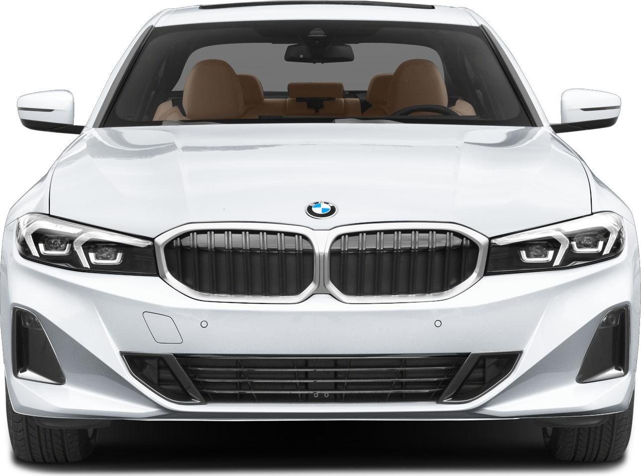 Front view of a white BMW sedan showing the kidney grille, headlights, and tan interior seats
