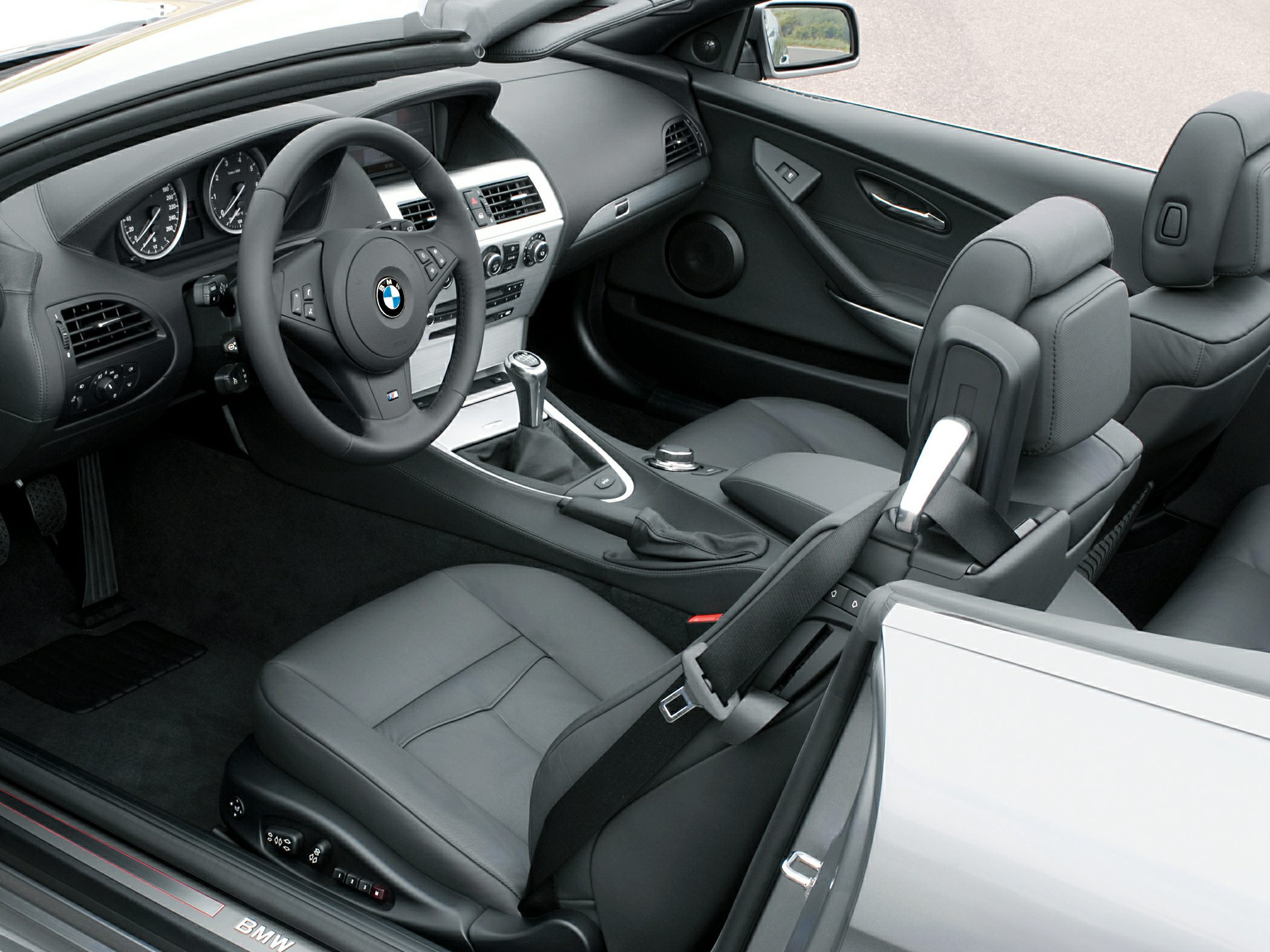 Luxury convertible interior with leather seats and modern cockpit design