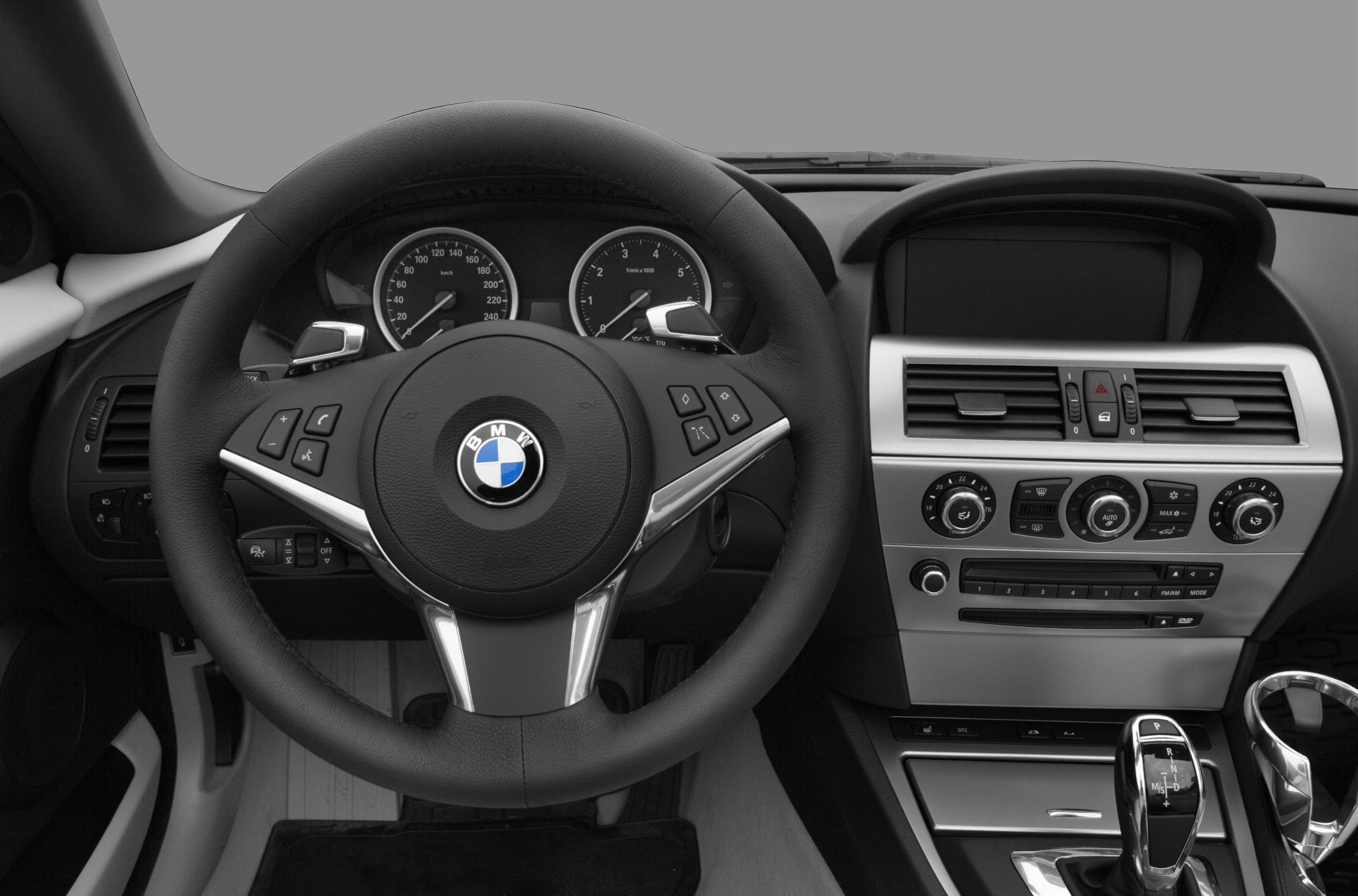 Steering wheel, dashboard with climate controls and gear shifter