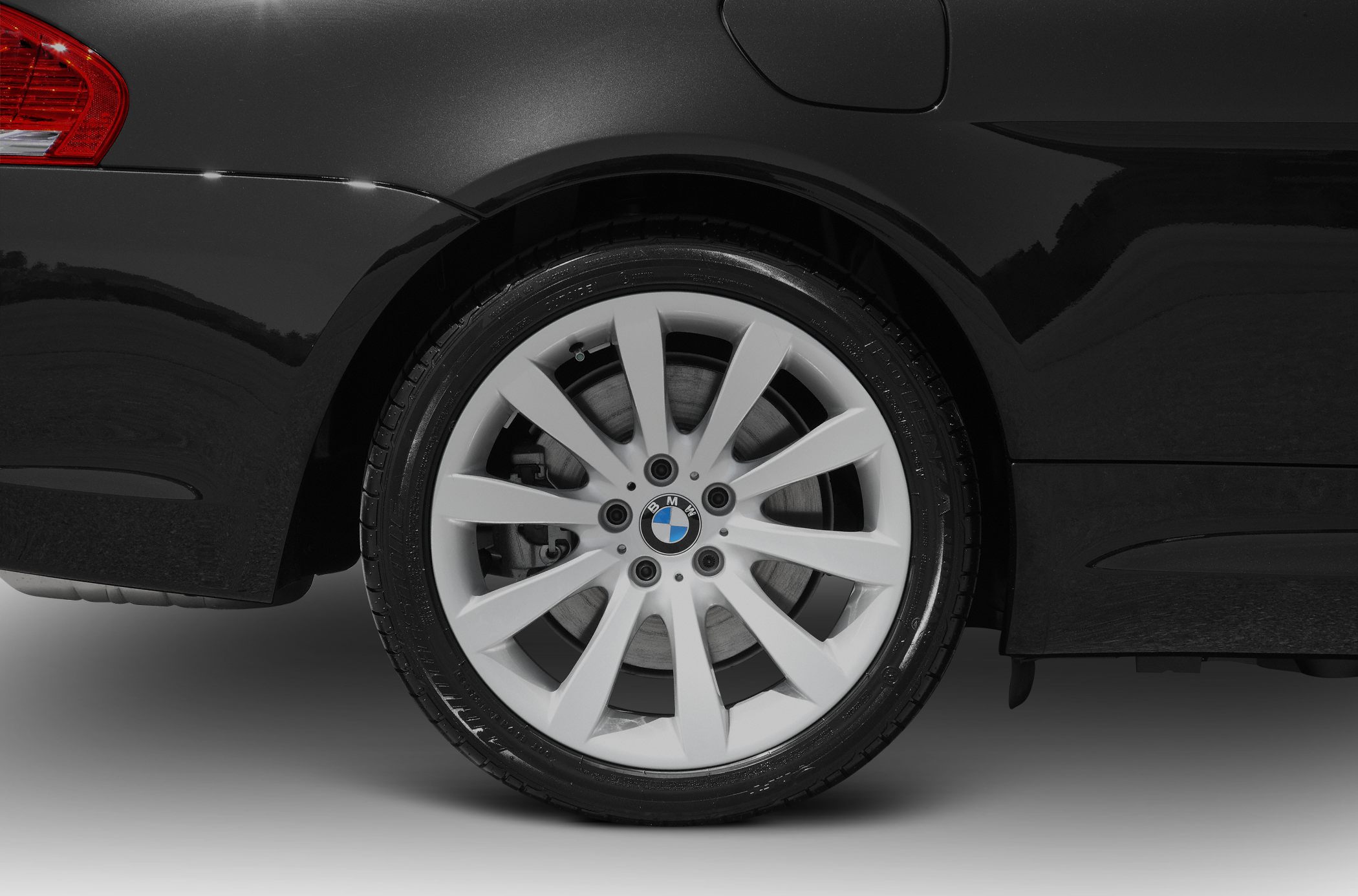 Close-up of alloy wheel and rear fender section.