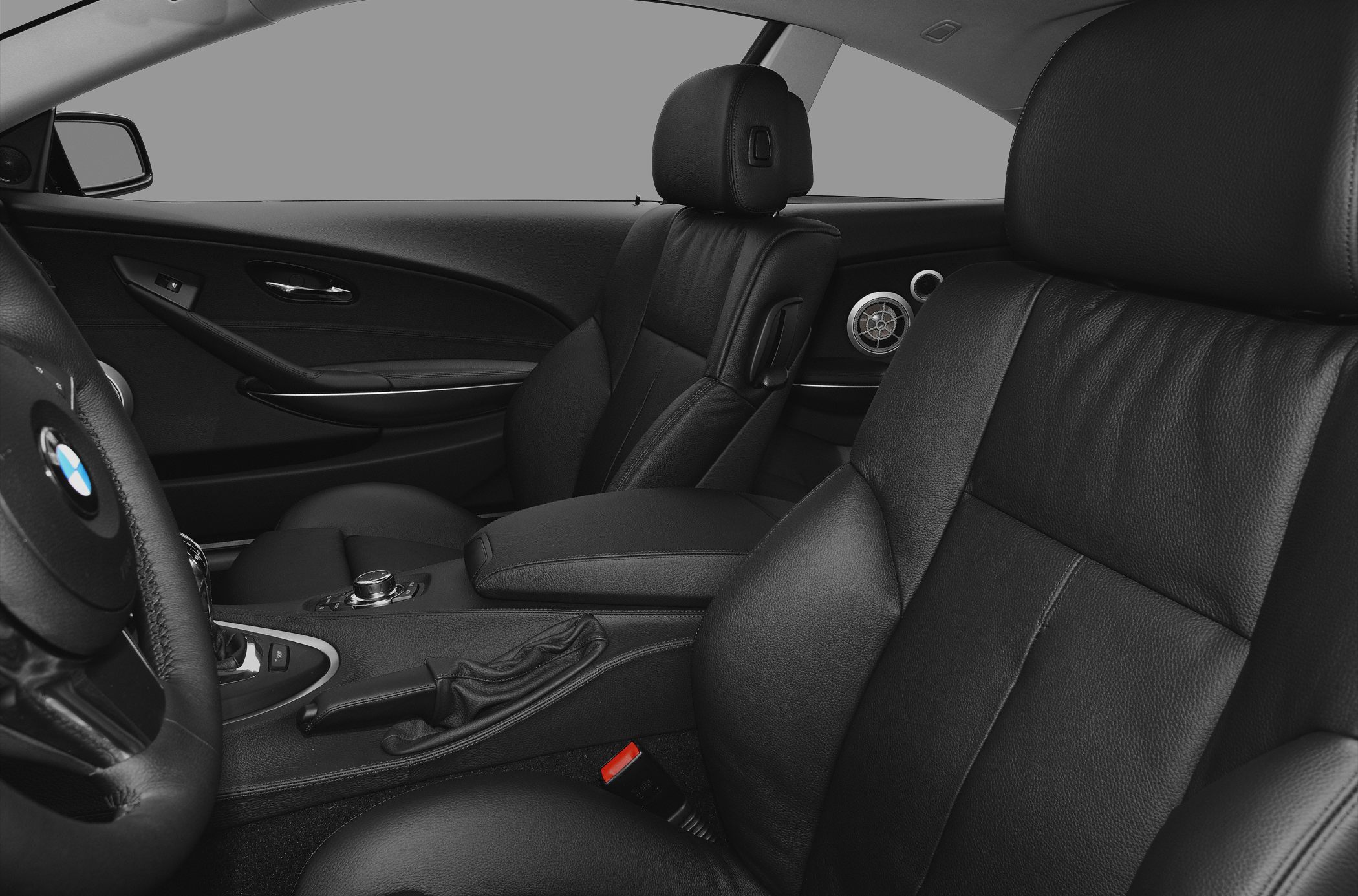 Black leather seats and modern interior design with controls and armrest