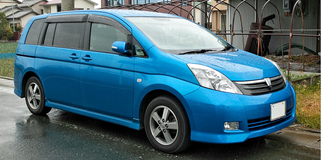 Blue minivan with sliding rear doors and alloy wheels
