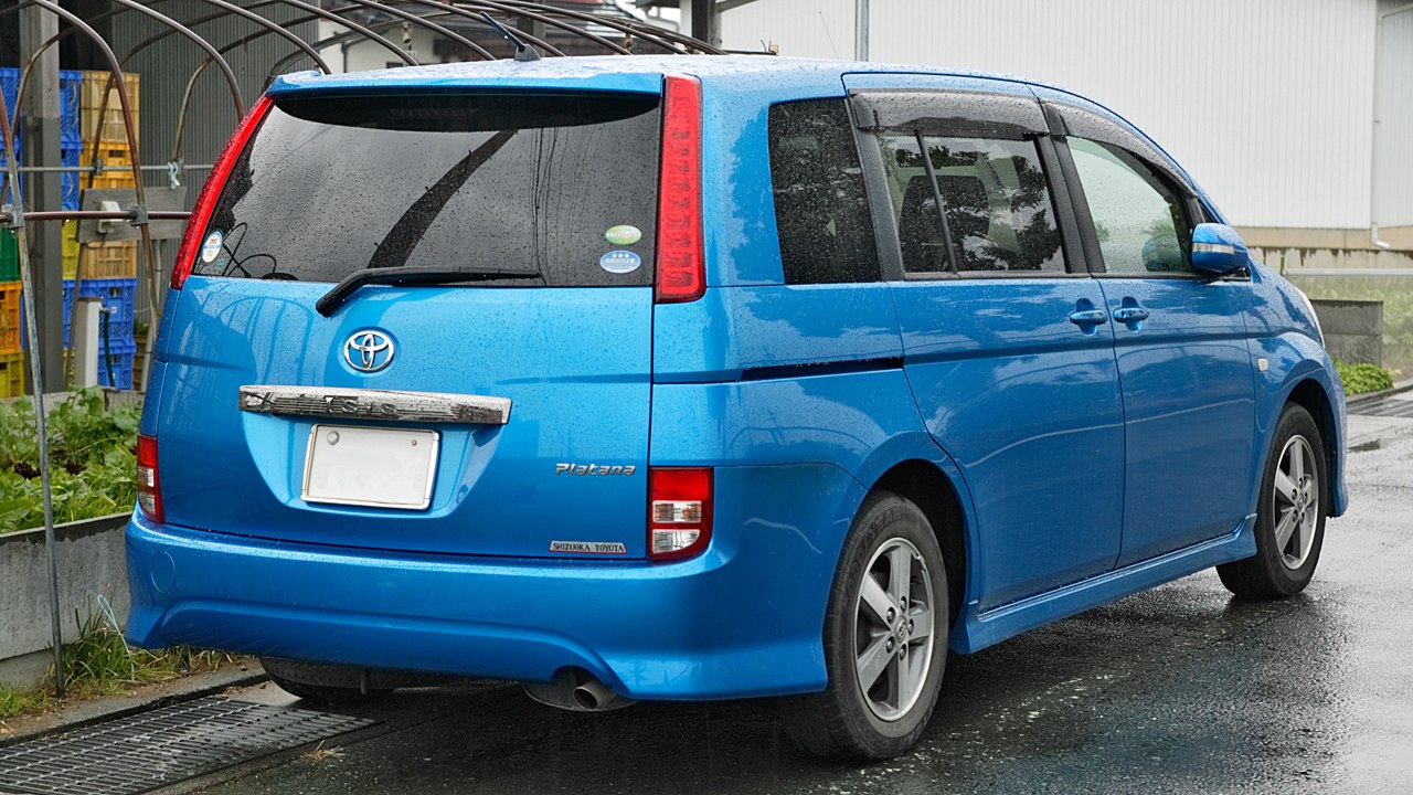 Rear view of blue MPV with vertical taillights and sliding side door