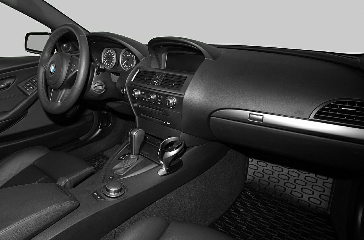 Car interior dashboard and center console with steering wheel and controls