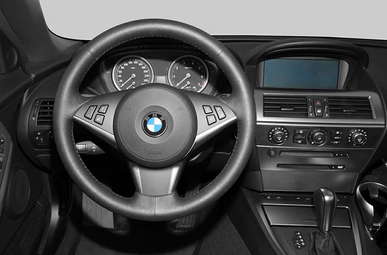 Steering wheel and dashboard with center console controls