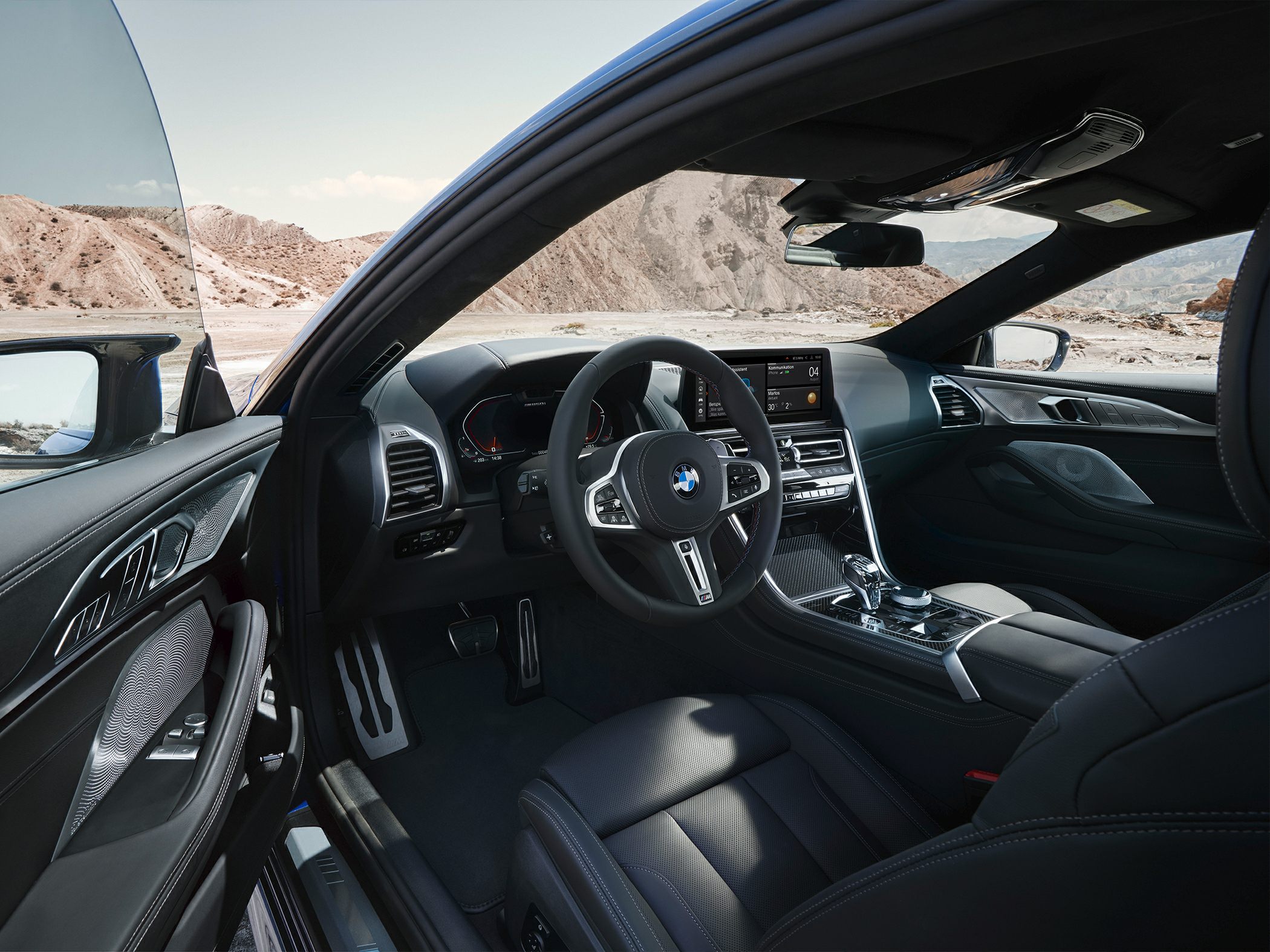 Modern luxury car interior with digital cockpit and dashboard.