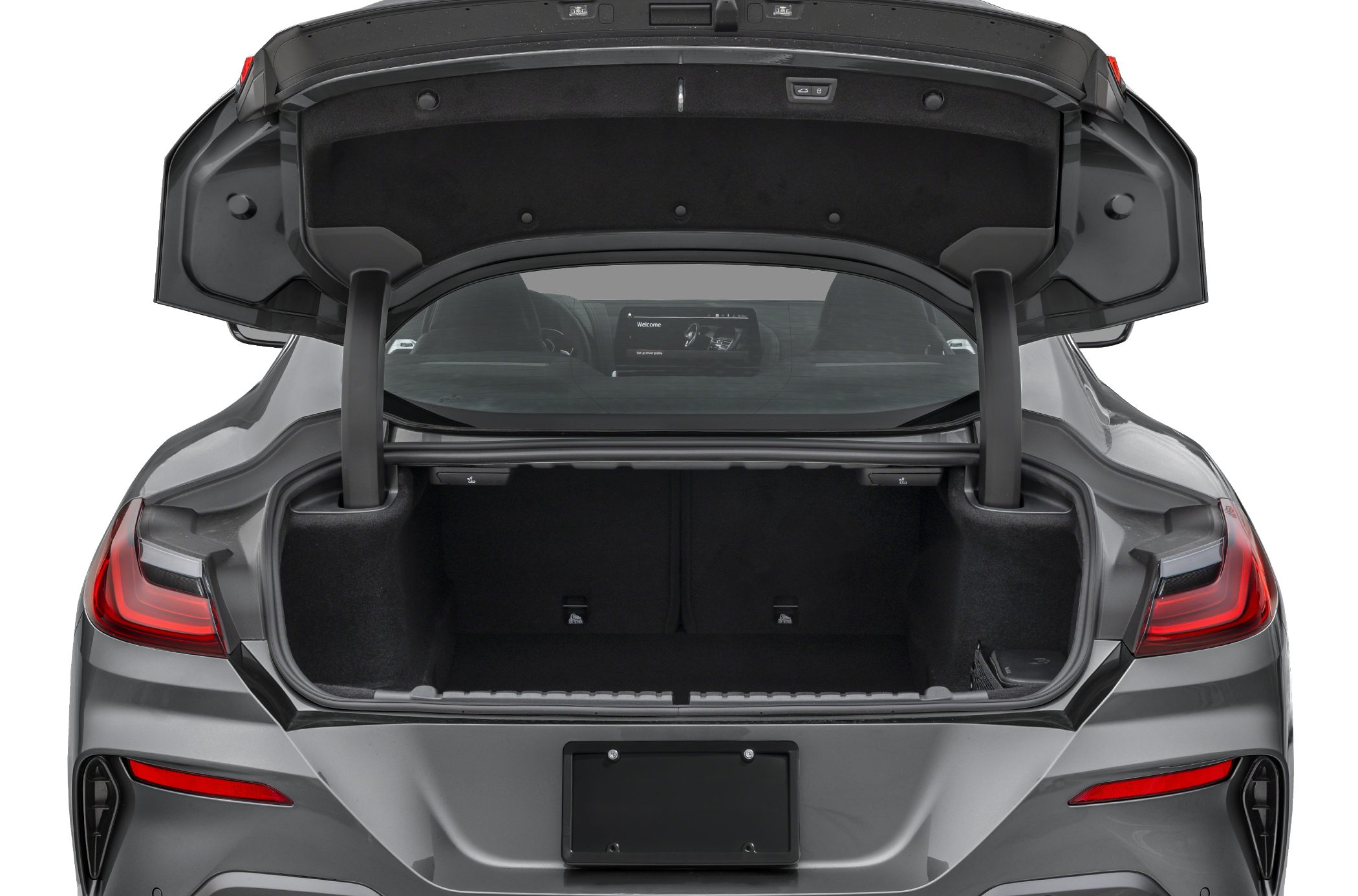 Open trunk of luxury coupe with spacious cargo area and rear seats visible