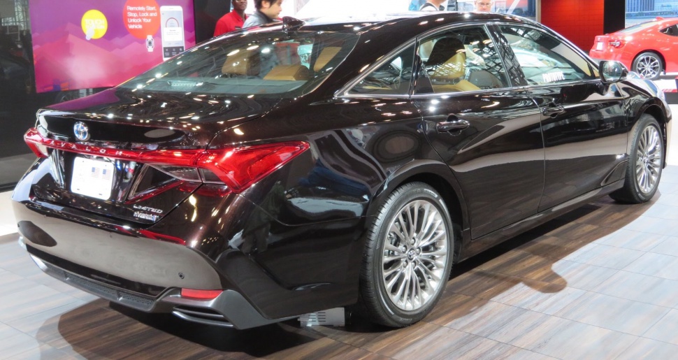 Rear and side profile of hybrid limited trim sedan with distinctive rear lights and alloy wheels.