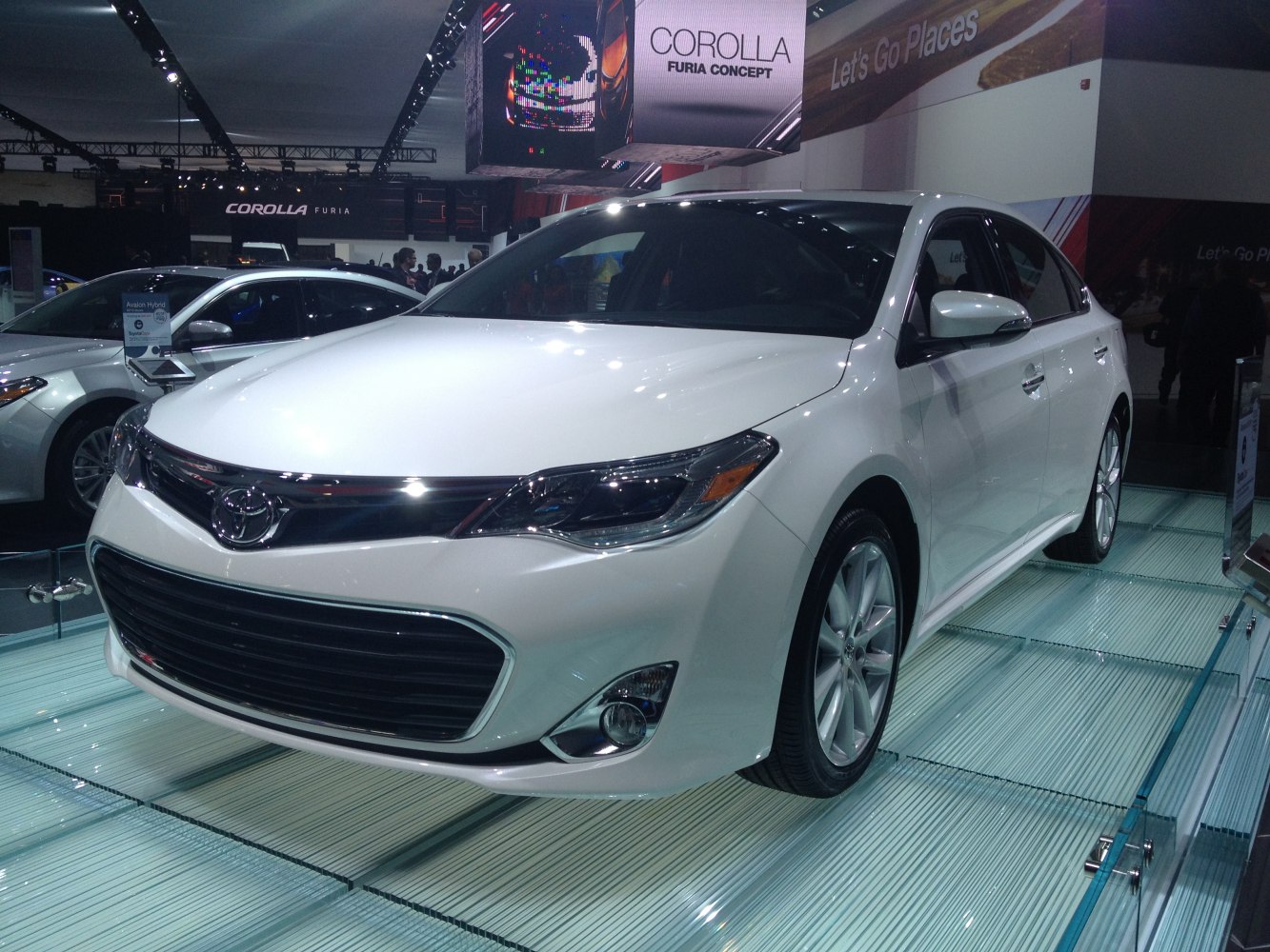 Close-up of front grille and headlights of a modern sedan.