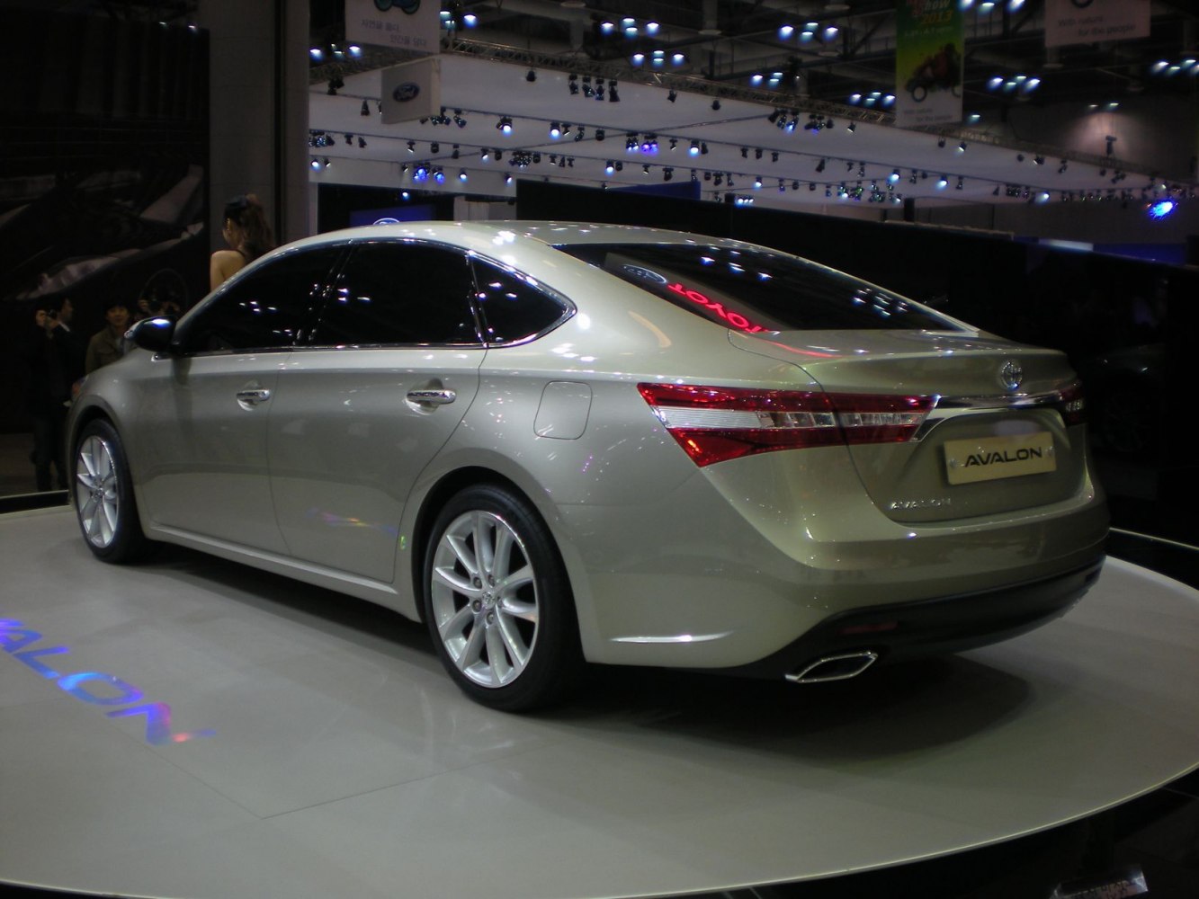 Mid-size sedan rear-side profile with sleek taillights and alloy wheels