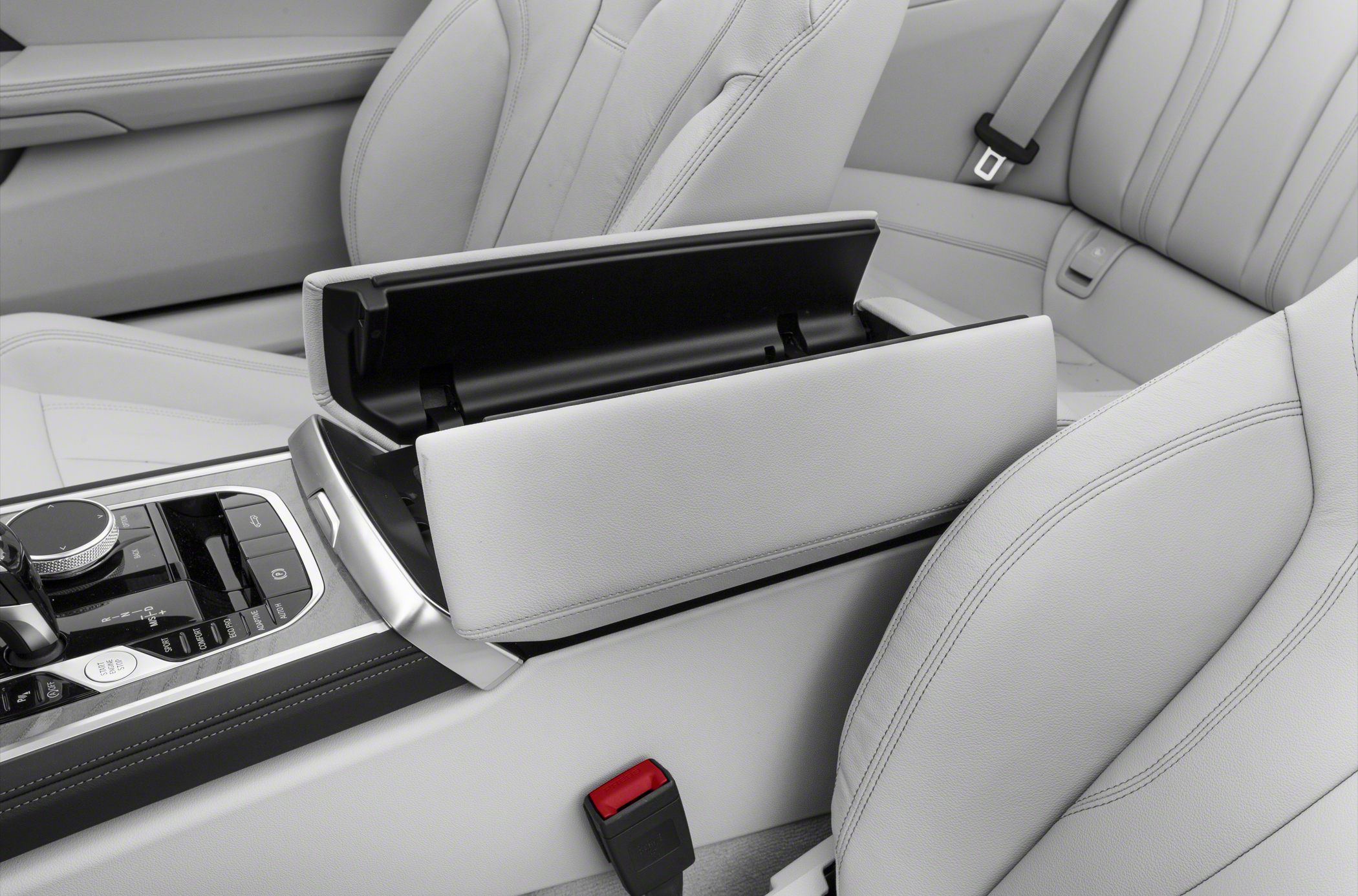 Open center console storage with leather seats and detailed stitching