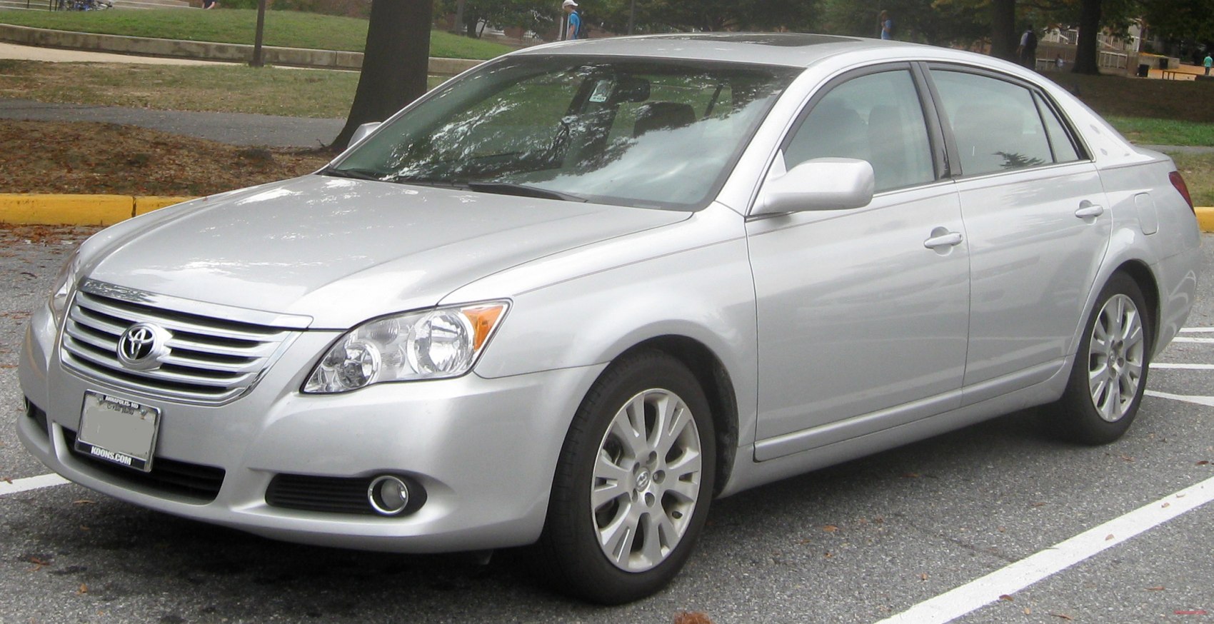 Silver mid-size sedan with chrome grille and alloy wheels