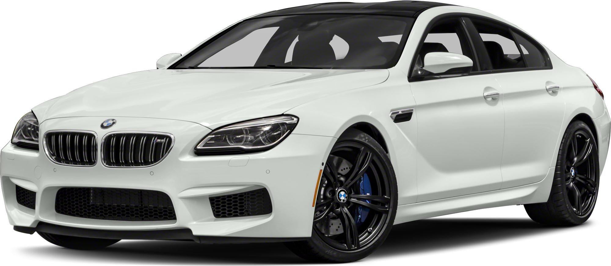 White luxury sports sedan with black alloy wheels and aggressive front styling