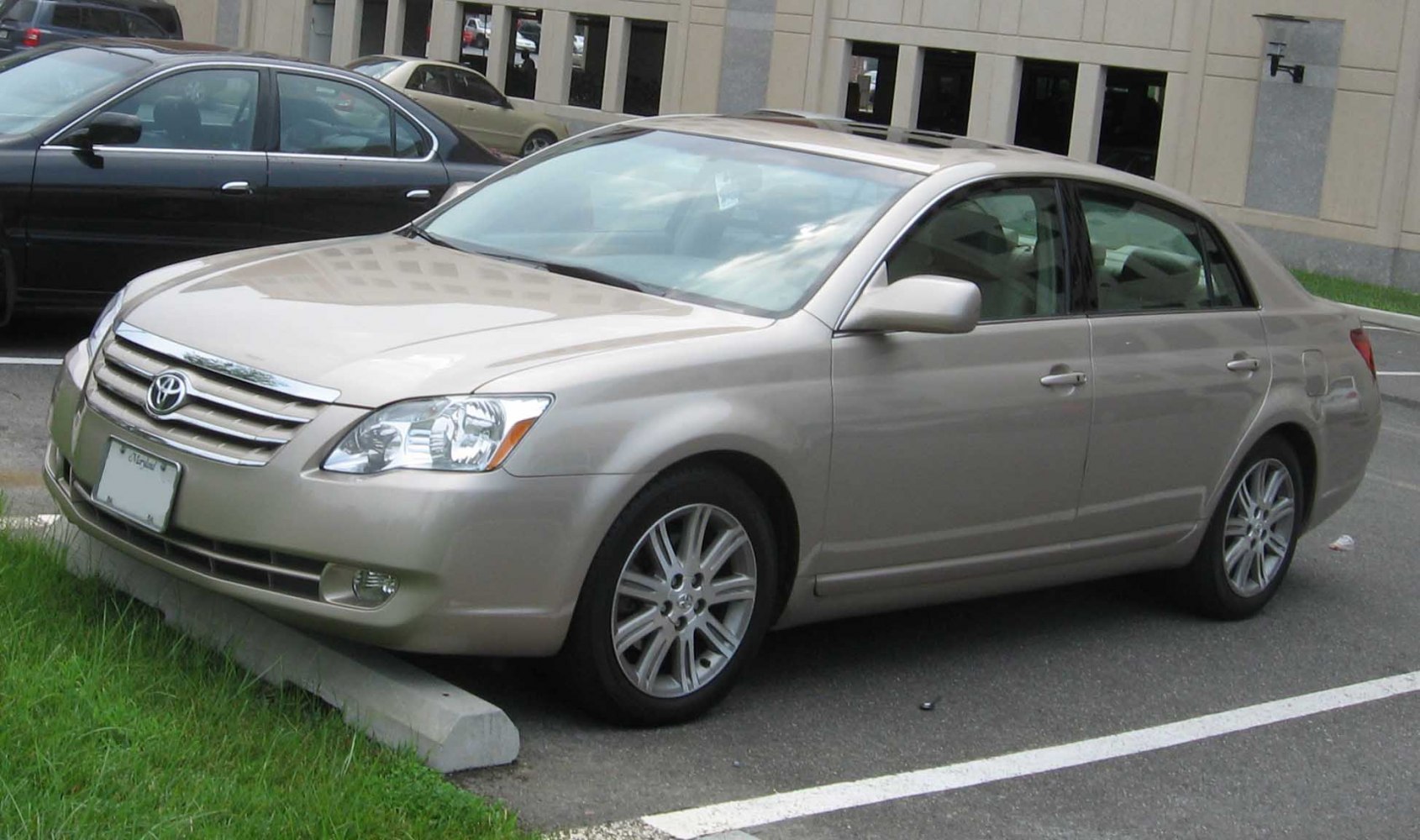Front-side view with alloy wheels and chrome grille
