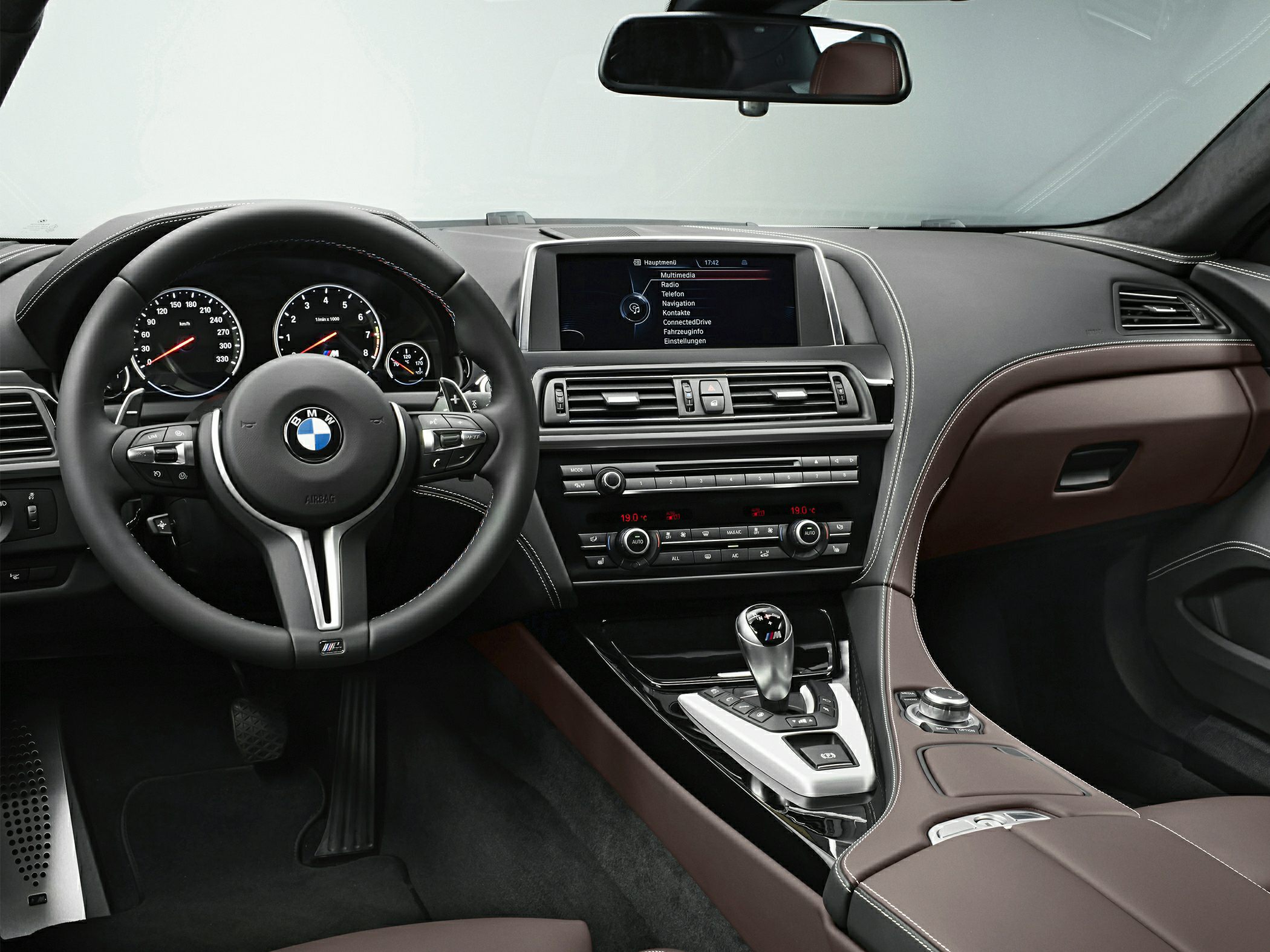 Sporty steering wheel and dashboard with center console and infotainment screen