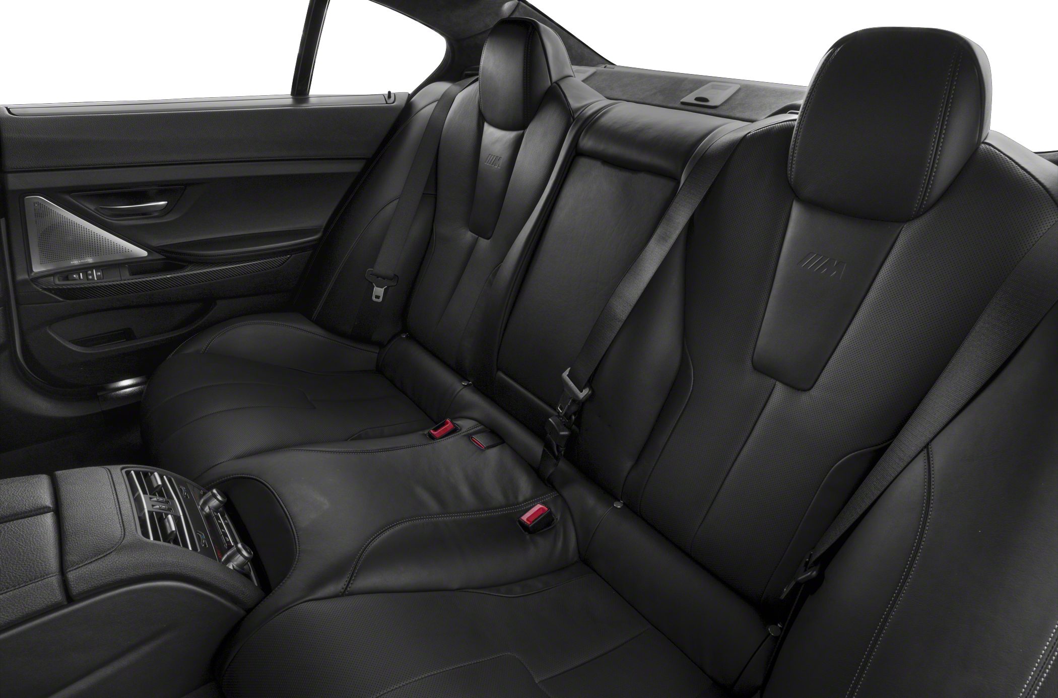 Black leather rear passenger seats with detailed stitching and integrated headrests