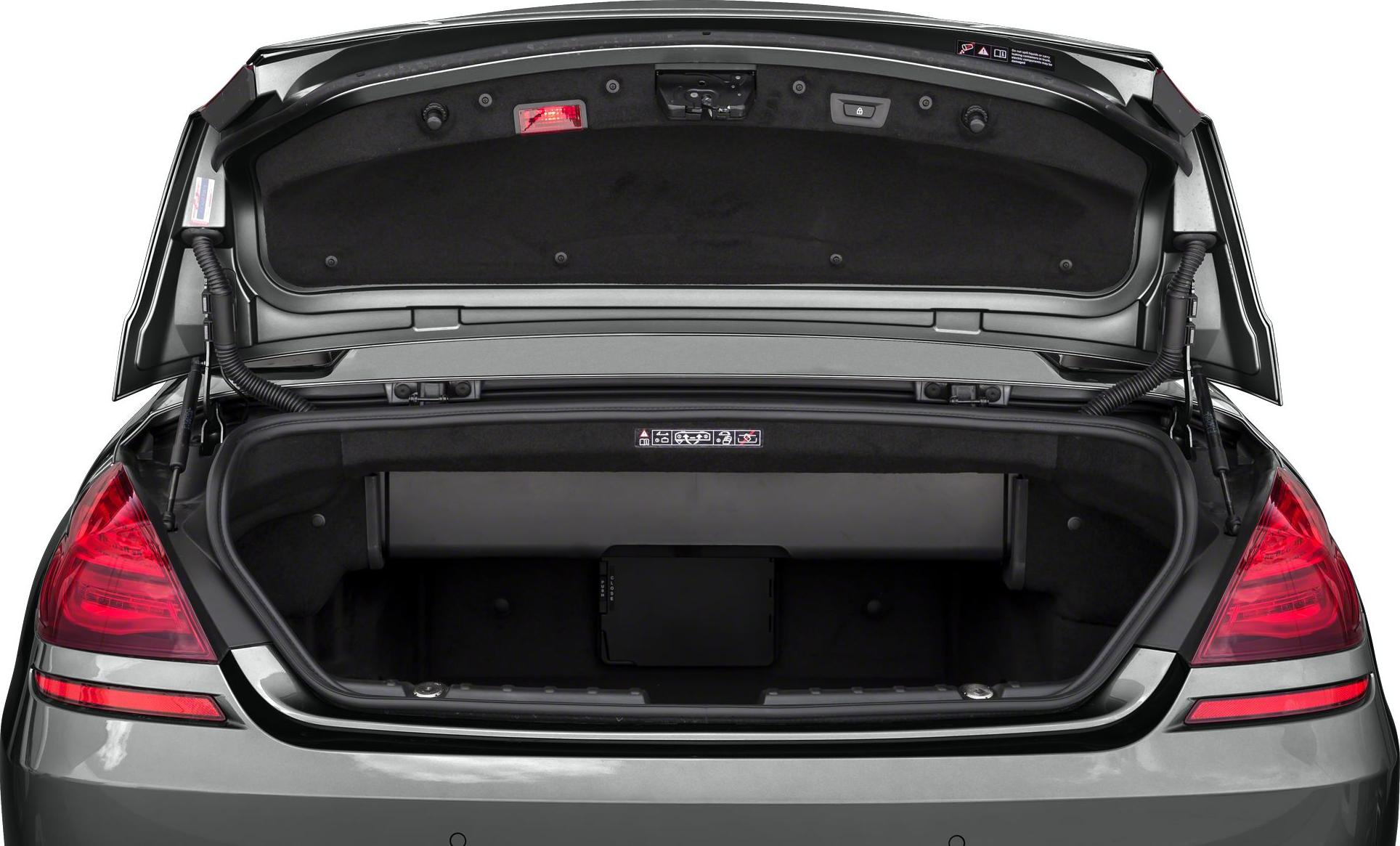 Open trunk of a 2014 convertible luxury vehicle with spacious cargo area.