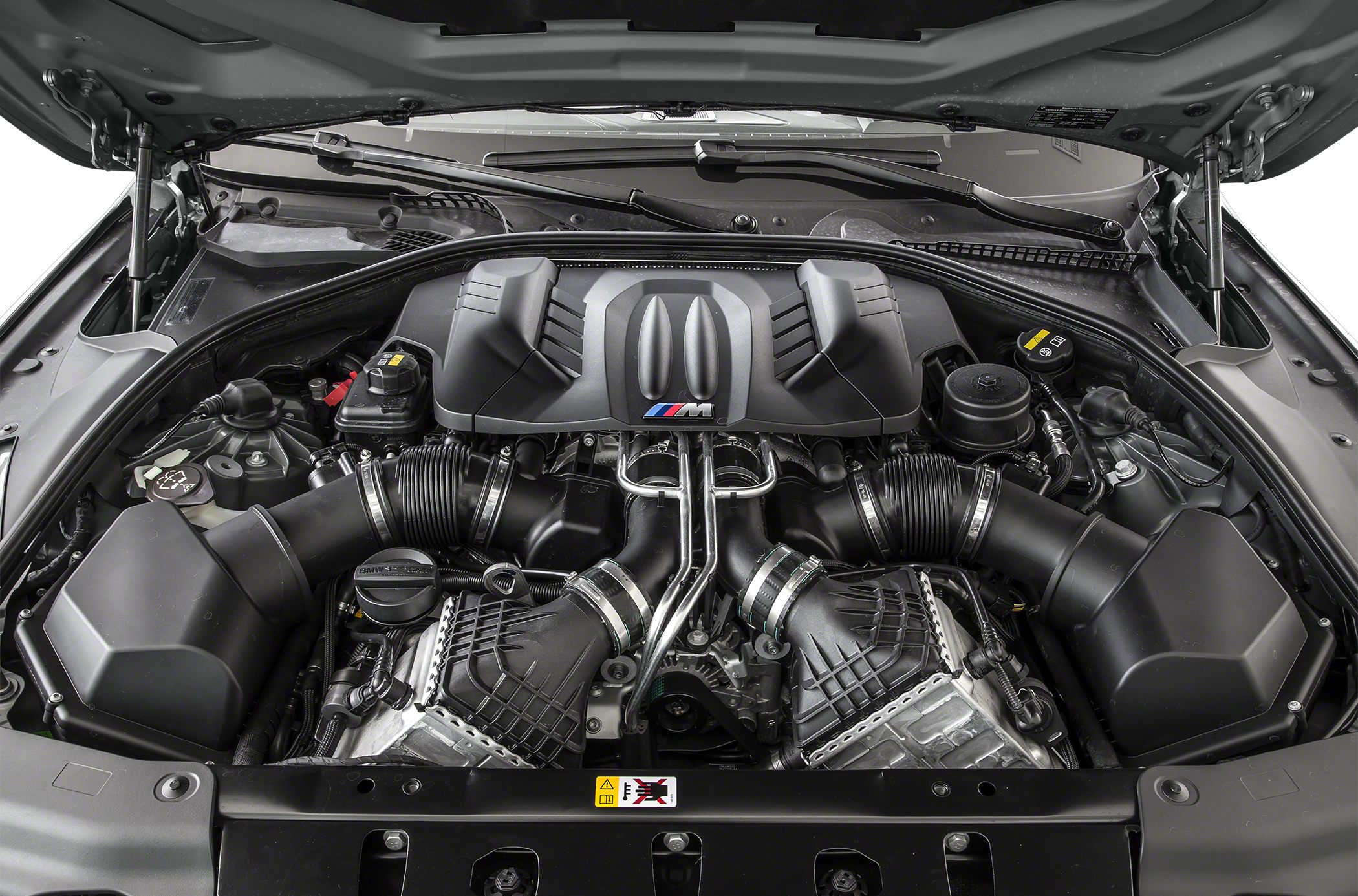 Detailed engine bay with M Performance cover and dual air intake system.