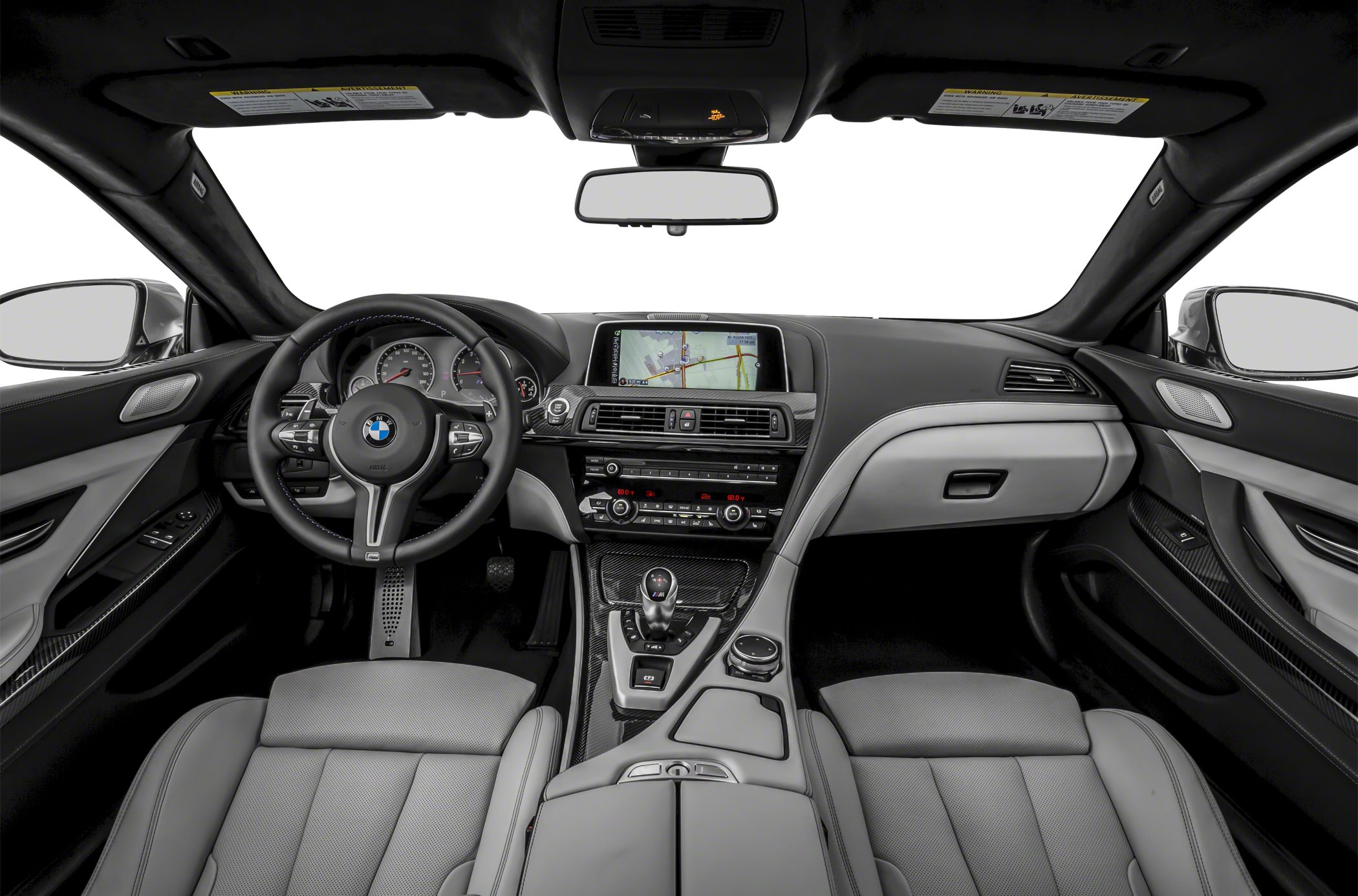 Car interior with dashboard, navigation screen, steering wheel, and center console.