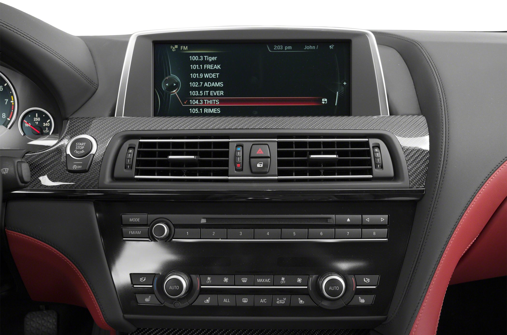 Infotainment display and carbon fiber dashboard trim with climate control panel