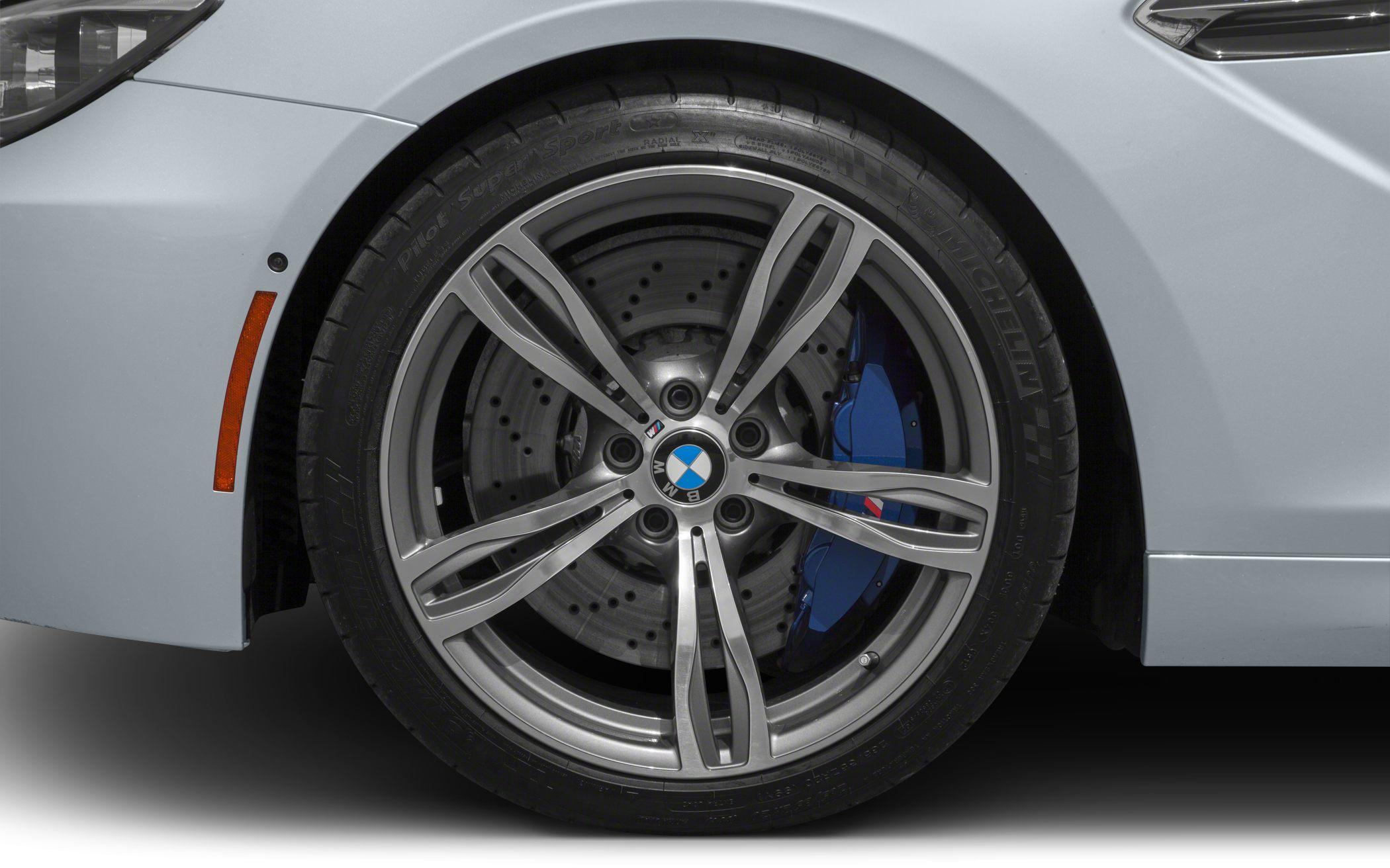 Close-up of alloy rim and blue brake caliper