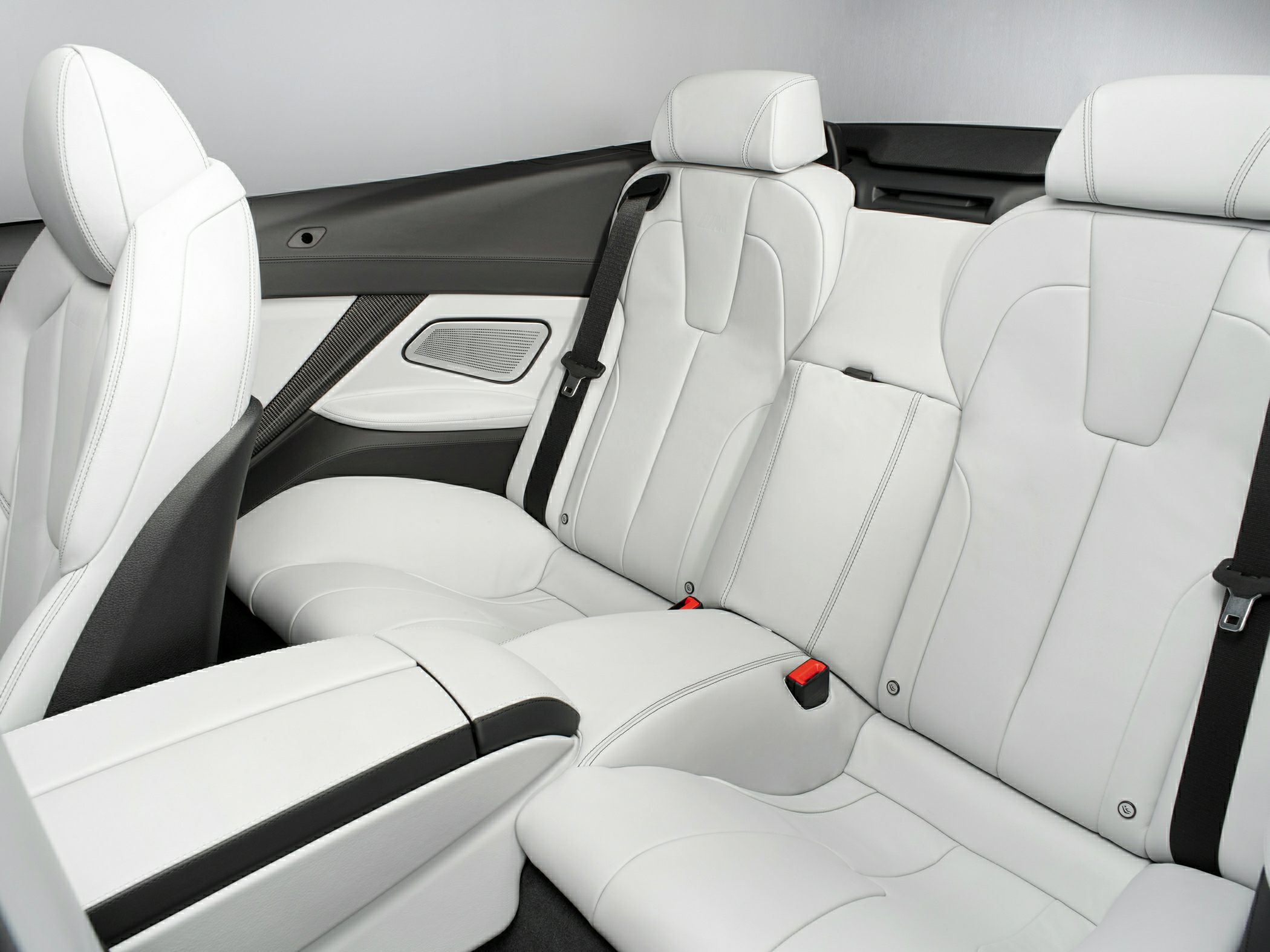 Luxury white leather rear seats with carbon fiber door trim