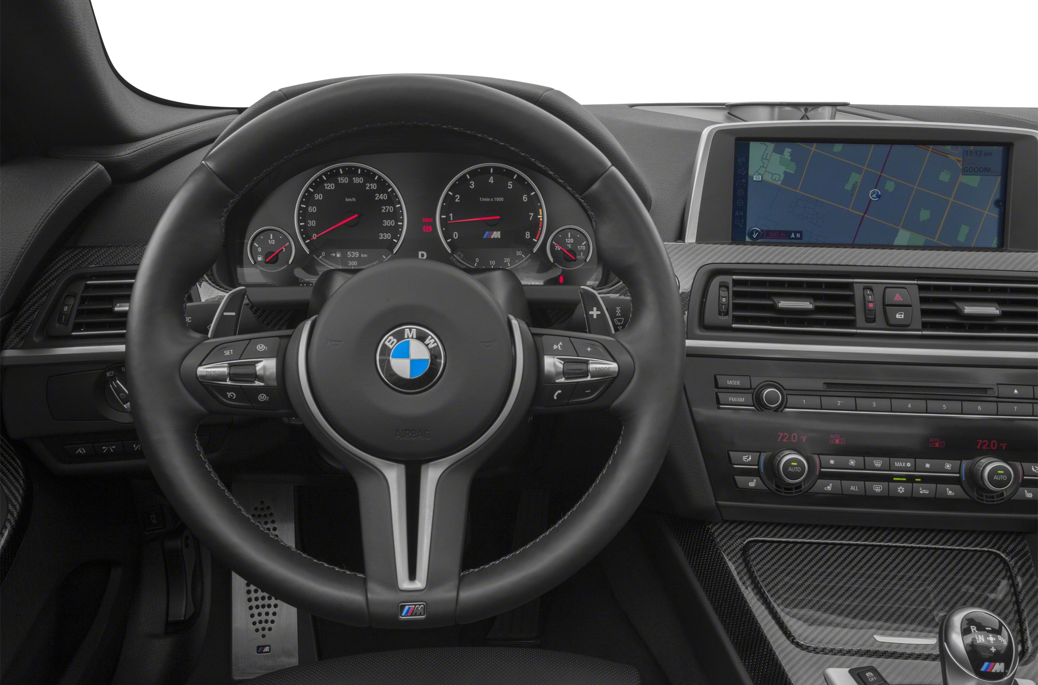 Sporty steering wheel with M badge and digital dashboard.