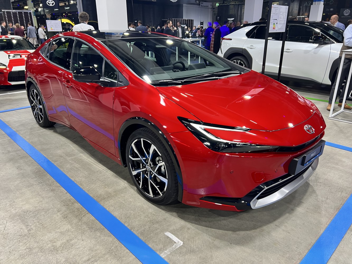 Sharp LED headlights and stylish alloy wheels on red modern vehicle