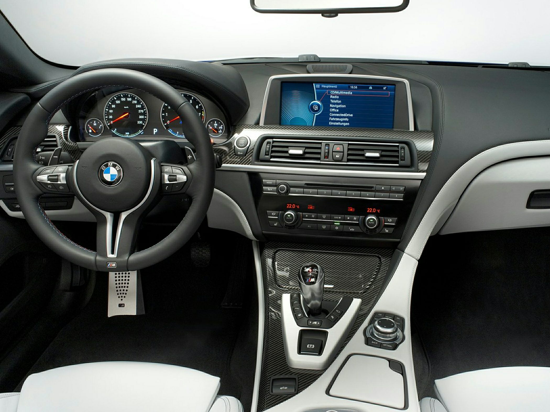 Steering wheel, digital display, carbon fiber trim, climate control panel