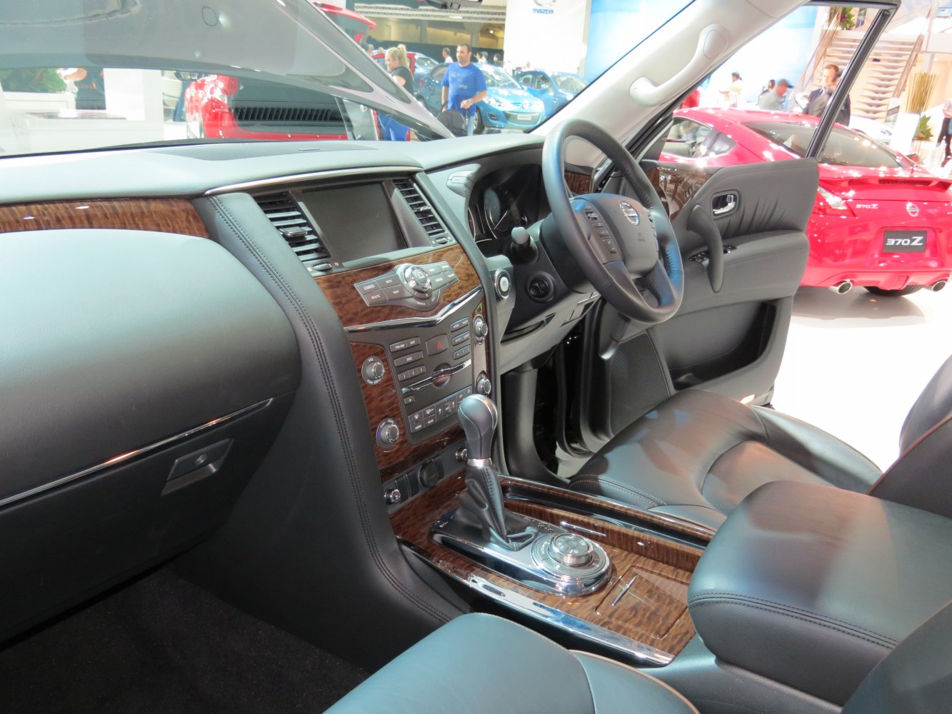 Luxury wood trim interior with detailed center console and gear shift