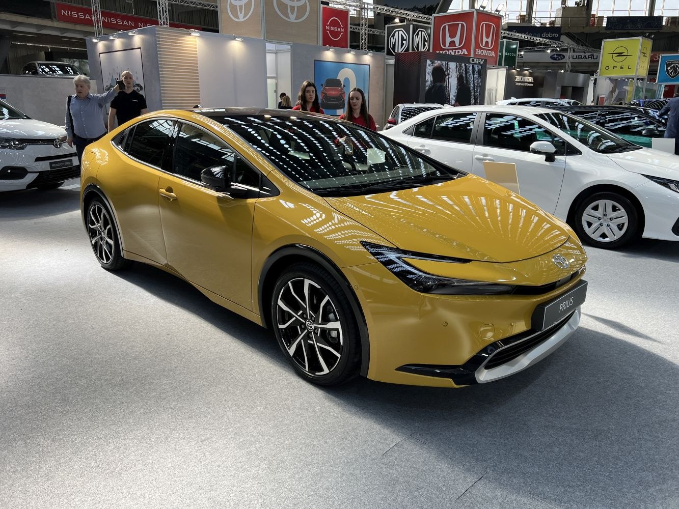 Yellow SUV with sharp LED headlights and sporty alloy wheels