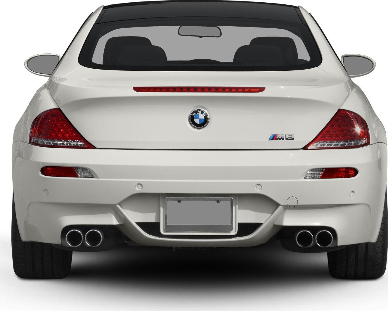 Rear view with quad exhausts and distinctive tail lights
