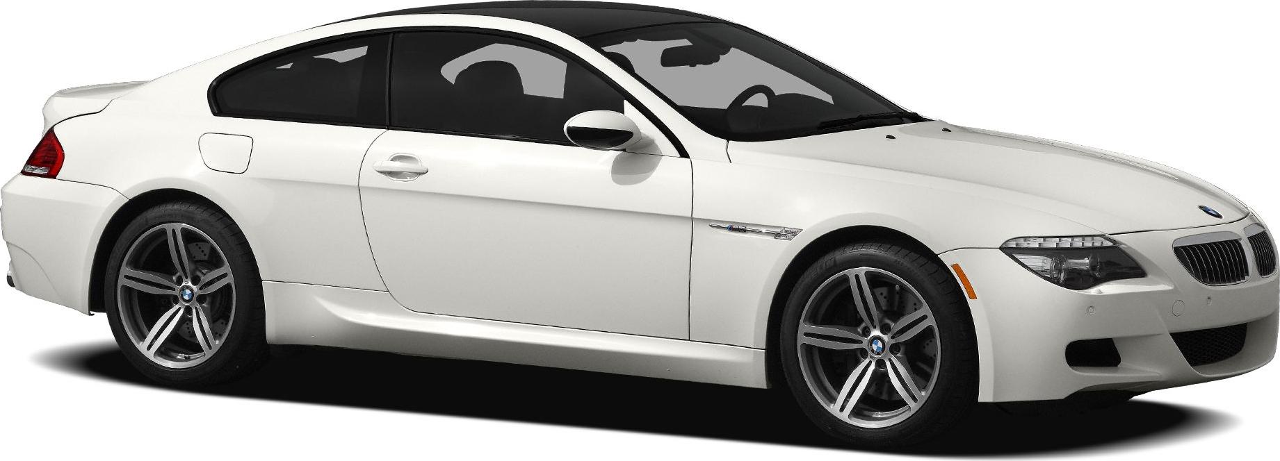 Side profile of white sporty coupe with alloy wheels and sleek design