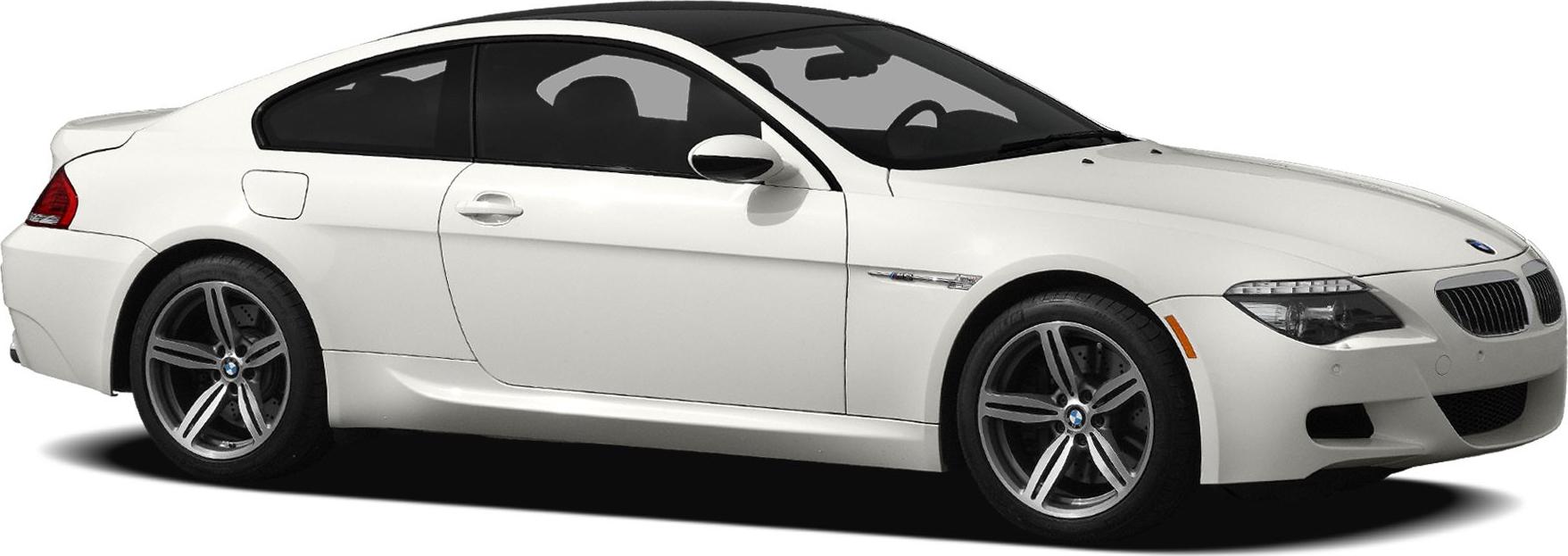 Side profile of white coupe with alloy wheels and sleek aerodynamic body