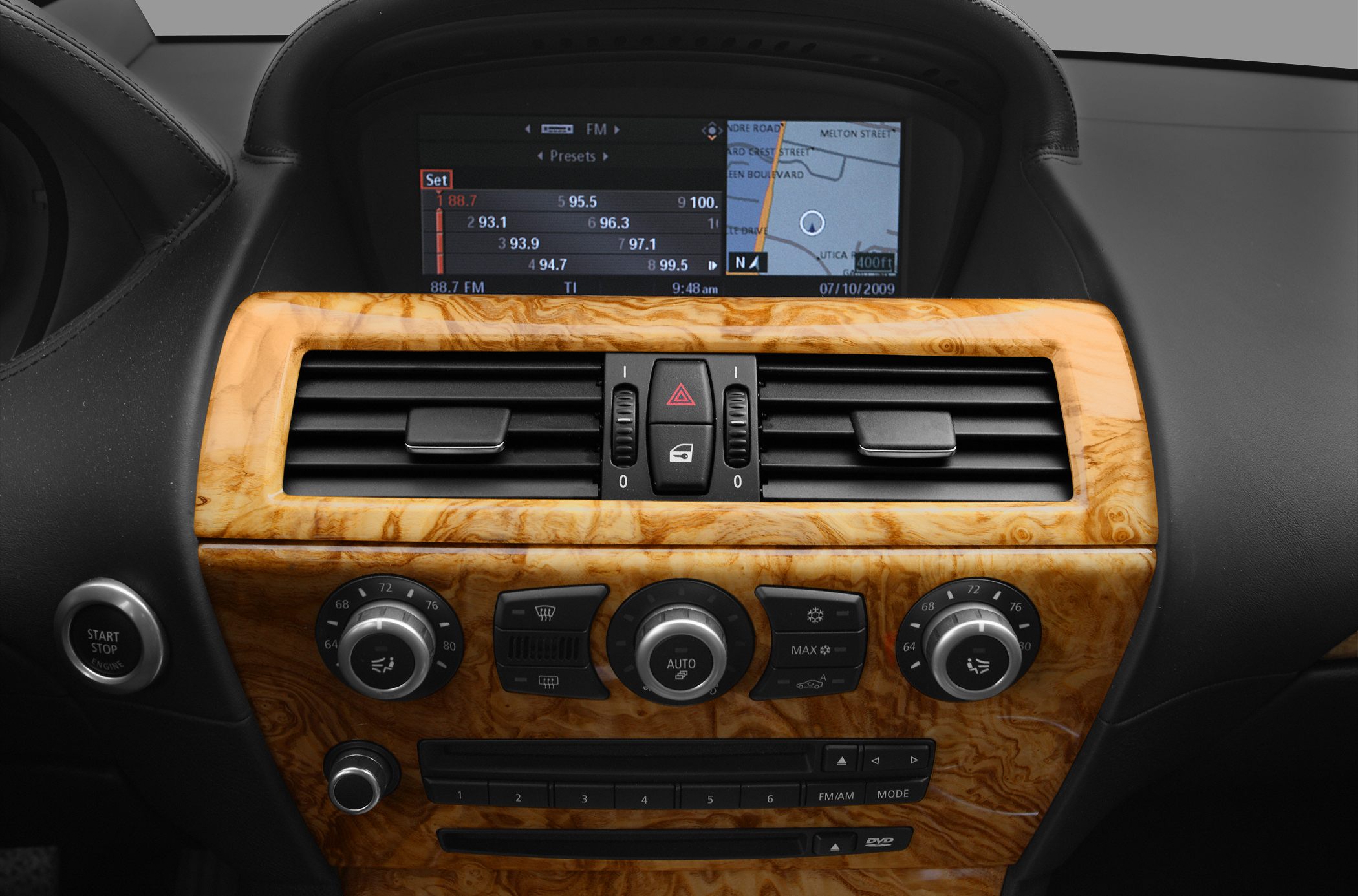 Wood trim dashboard with climate controls and navigation display