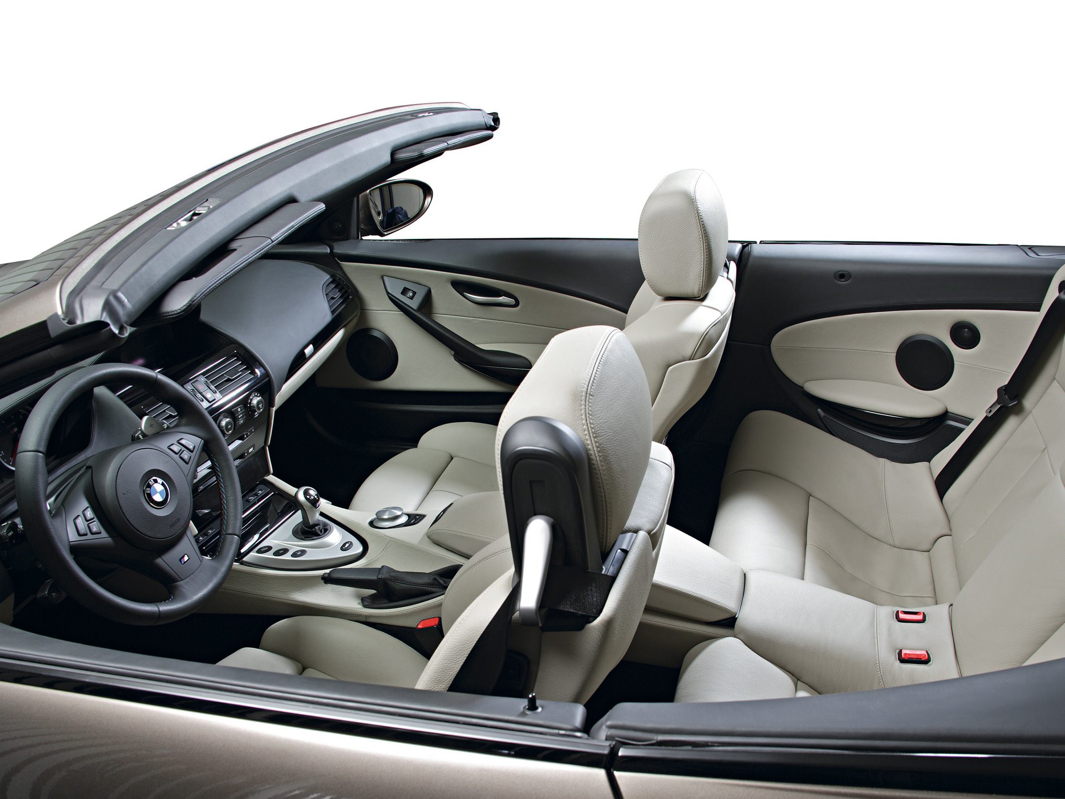 Luxury convertible interior with leather seats and sleek dashboard.