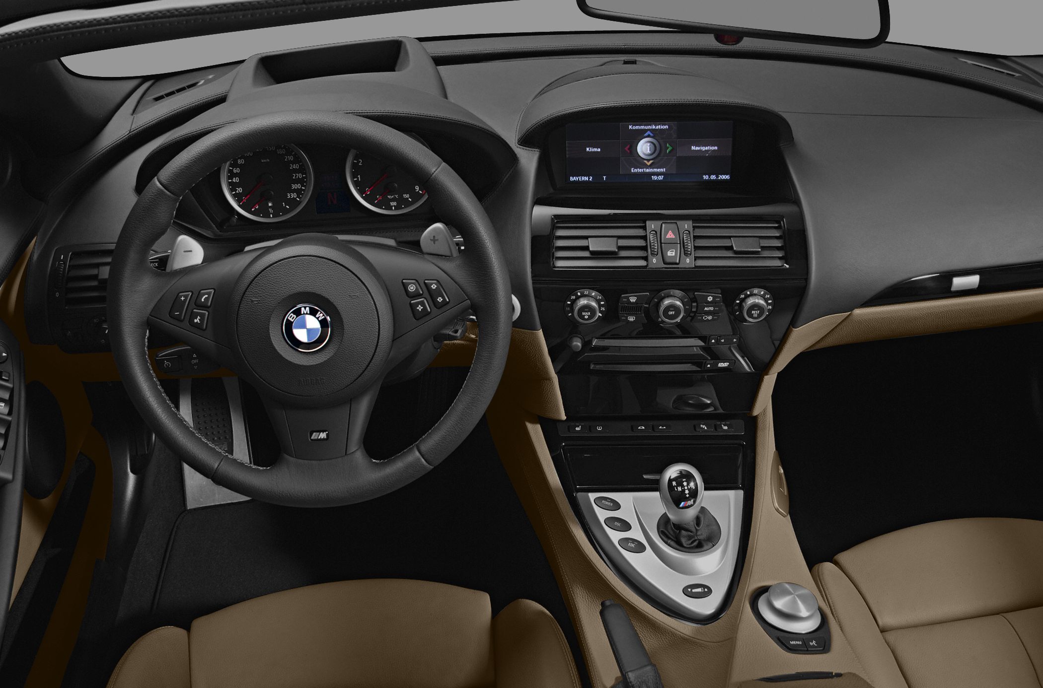 Luxury interior with manual gear shifter, multifunction steering wheel, navigation screen