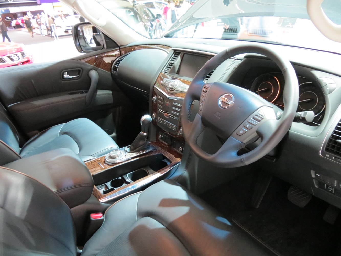Luxury SUV interior with leather seats and wood trim accents