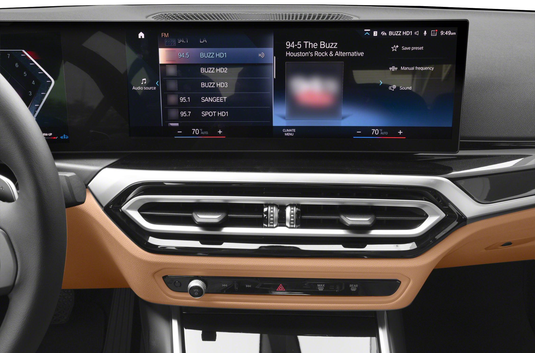 Digital infotainment display and climate control air vents with control buttons