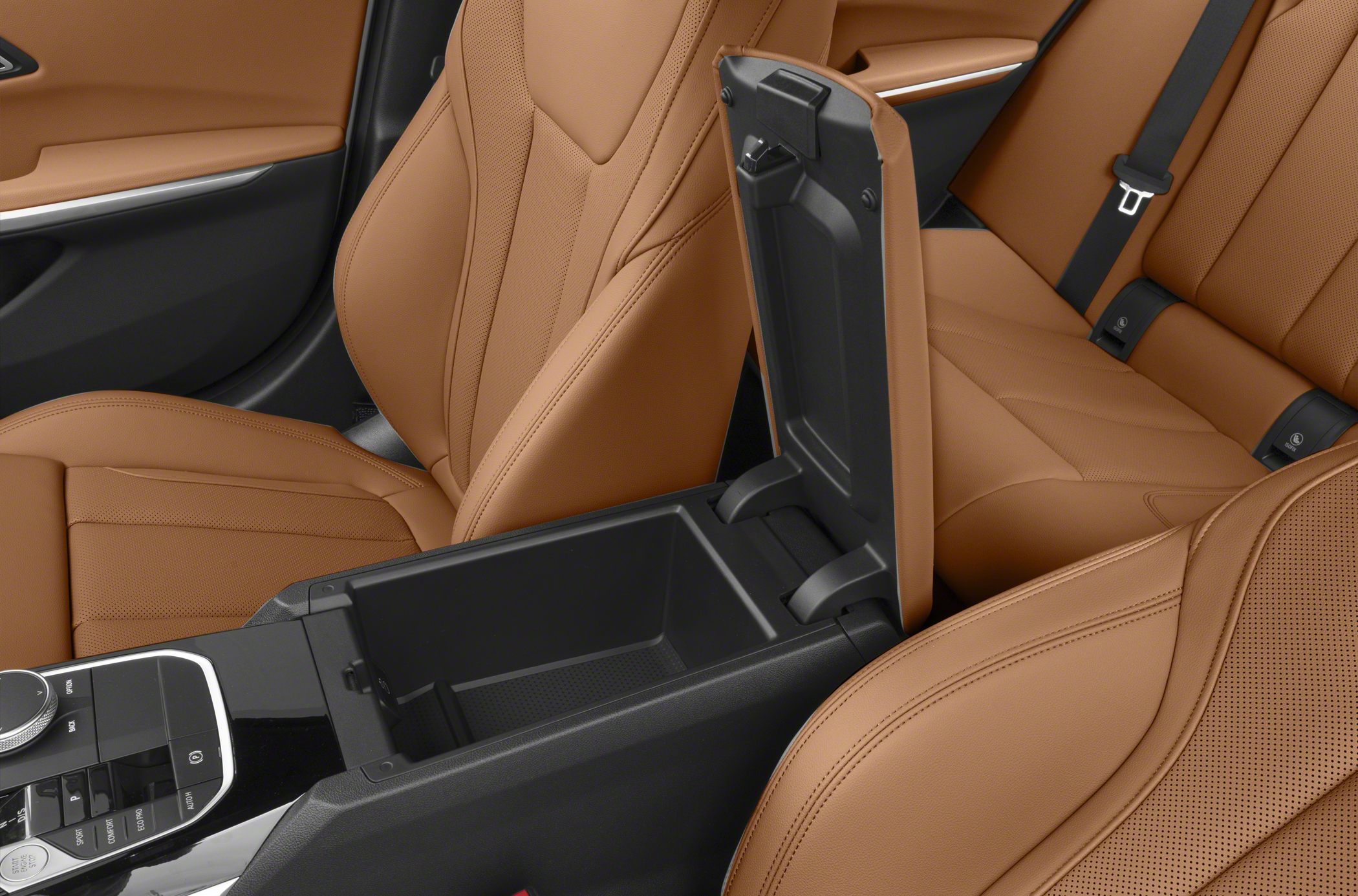 Open center console storage with tan perforated leather seats