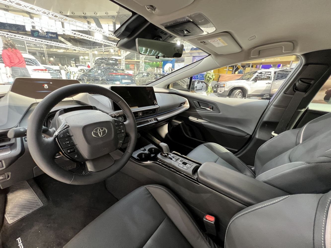Interior cockpit with steering wheel, digital dashboard, and center console