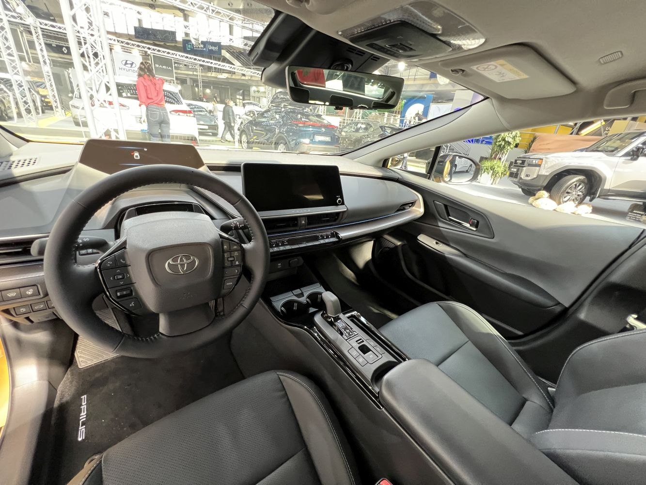 Steering wheel and digital dashboard with center console in car interior