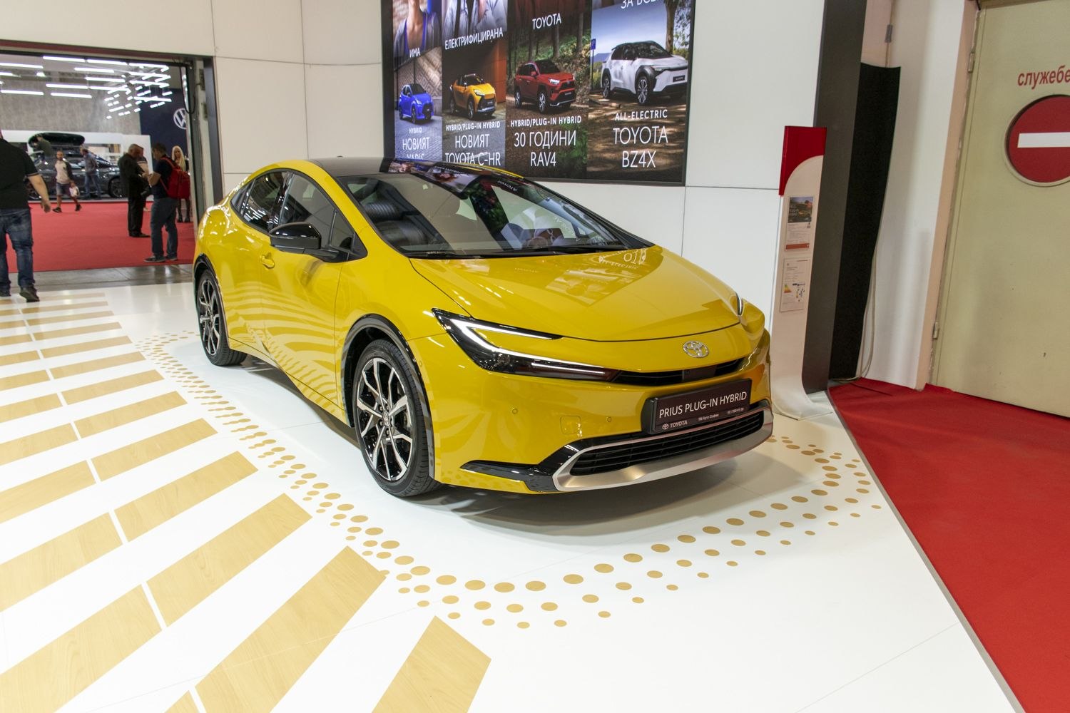 Front view of a sleek hatchback with LED headlights and sporty wheels