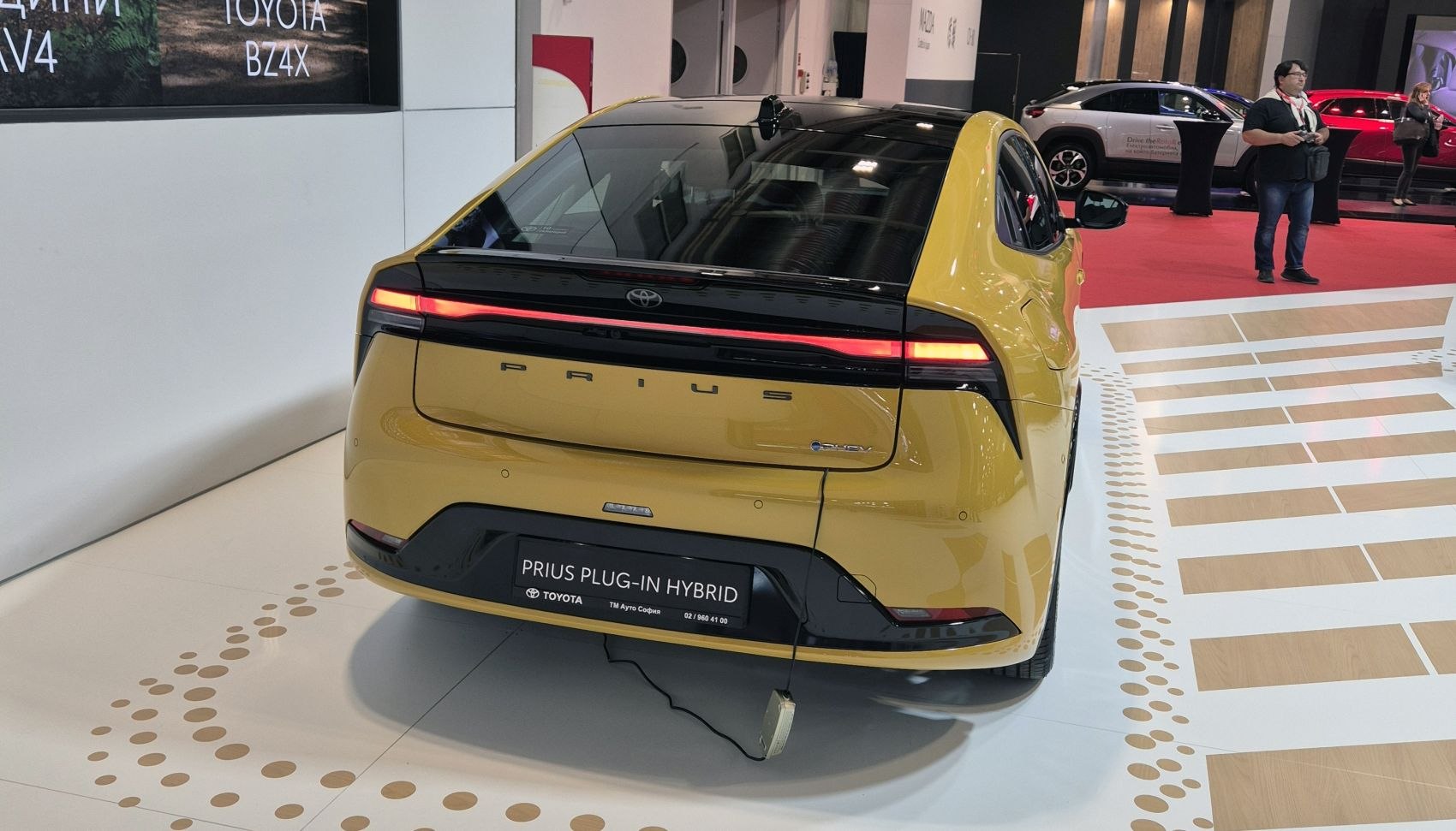 Rear view of a modern hatchback with full-width LED tail light.