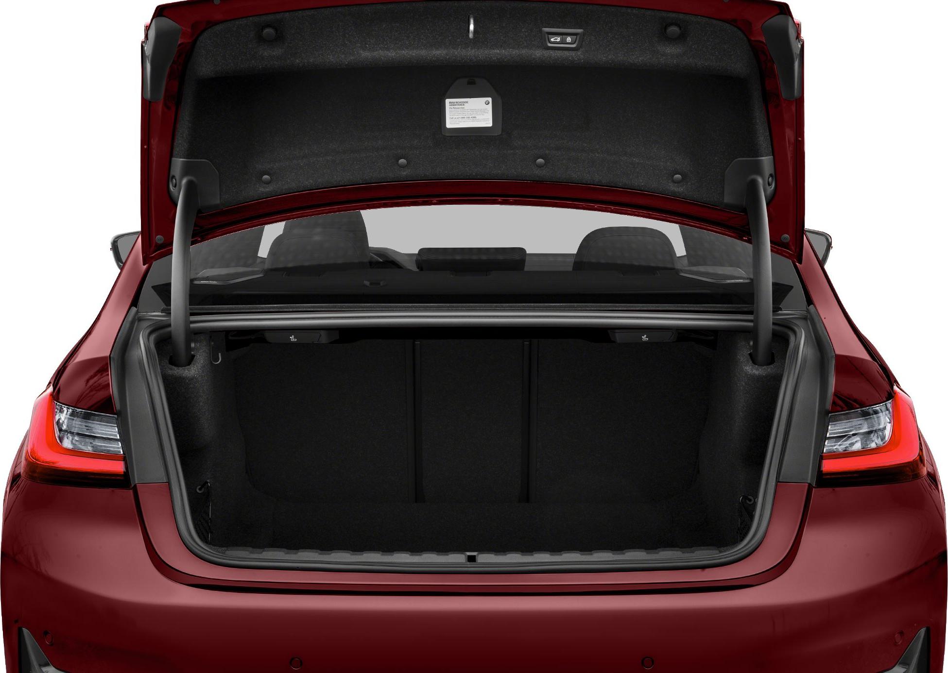 Open trunk of a modern sedan showing spacious cargo area and rear light design