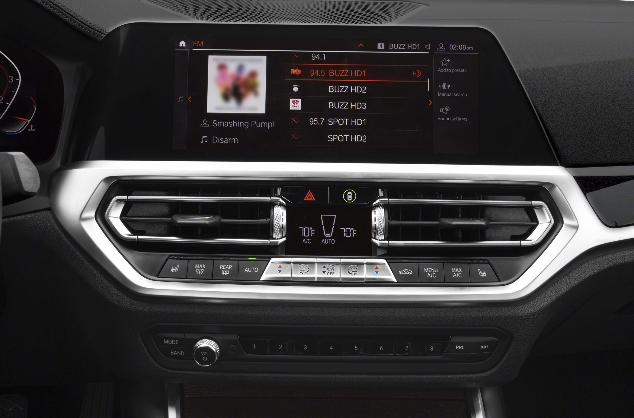 Multimedia touchscreen and dual-zone climate control panel with vents