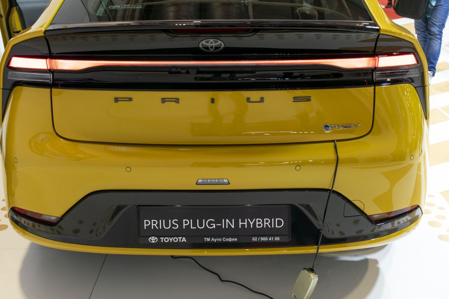 Sleek rear design with continuous LED tail light and hybrid badges.