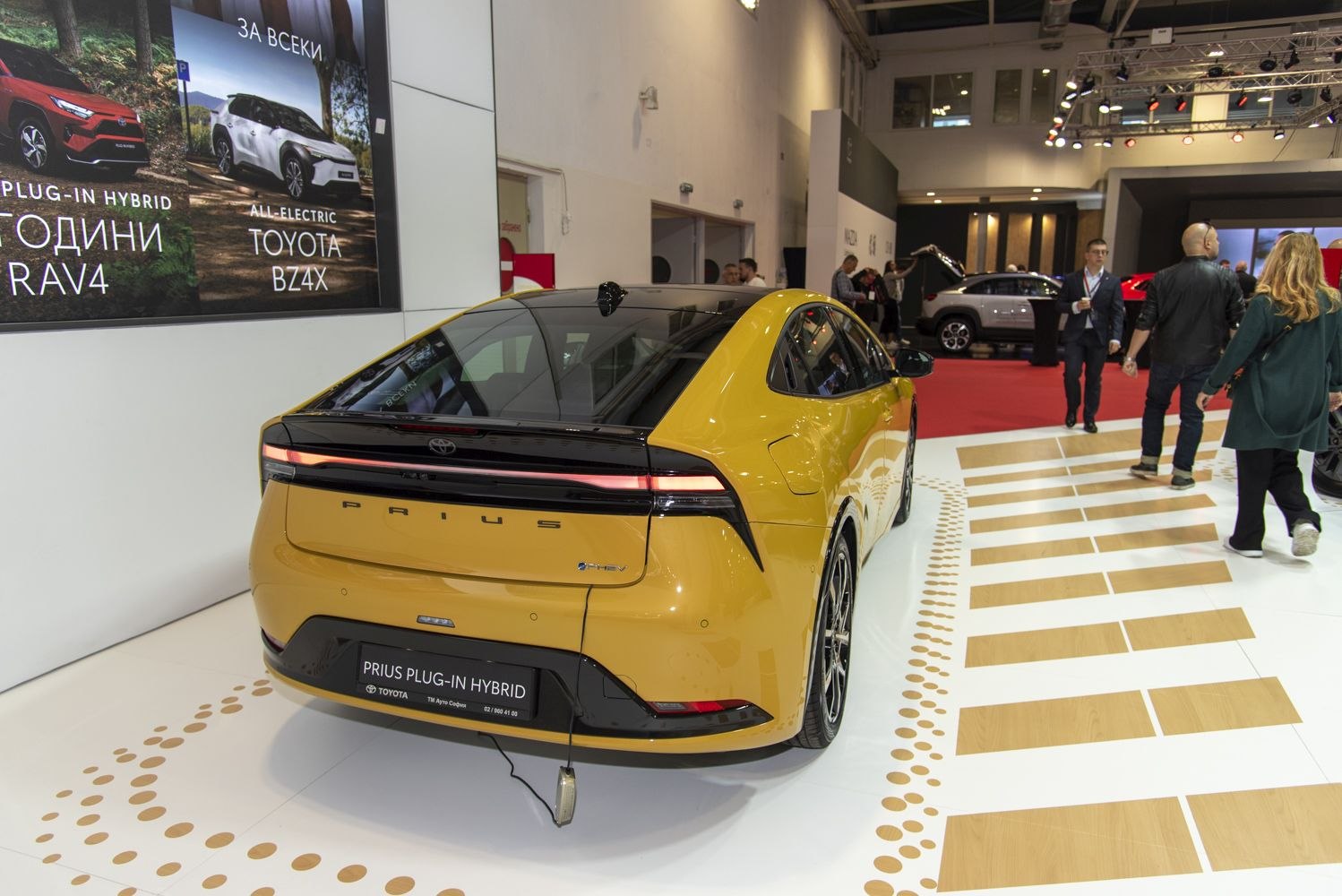 Rear view of a modern plug-in hybrid with sleek taillights and aerodynamic styling