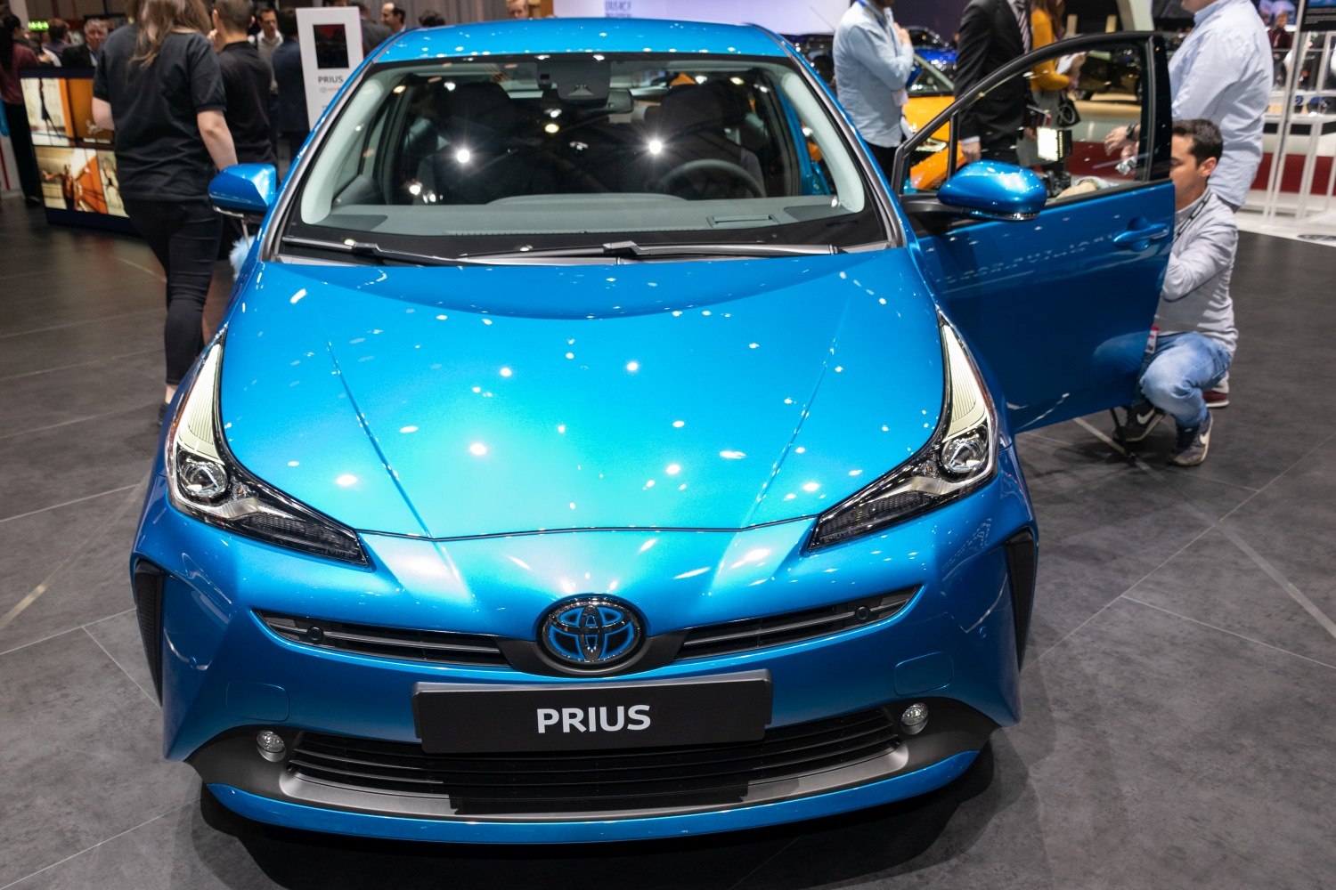 Front view with sleek headlights and bold grille in vibrant blue