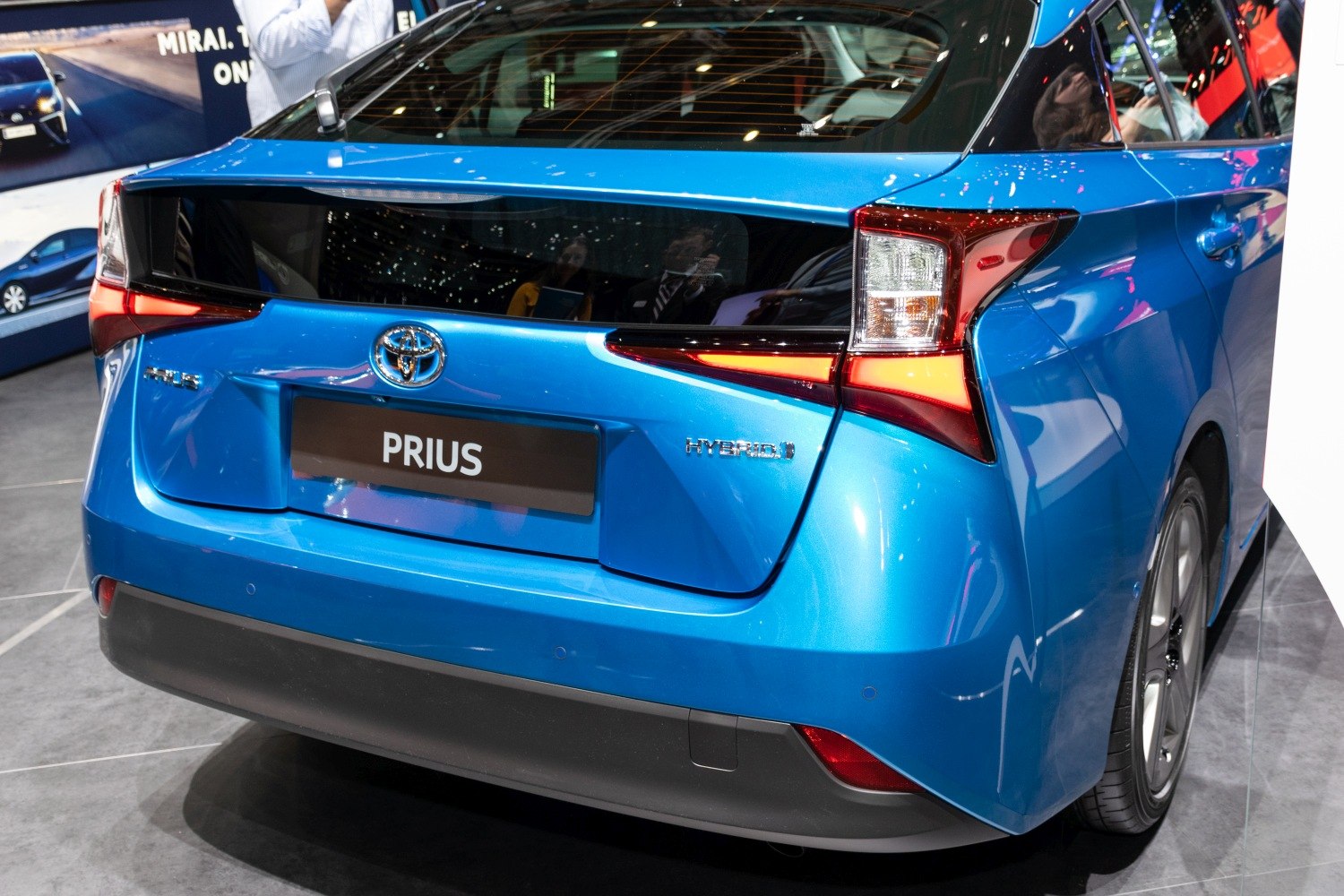 Rear view of hybrid hatchback with distinctive taillights and hybrid badge